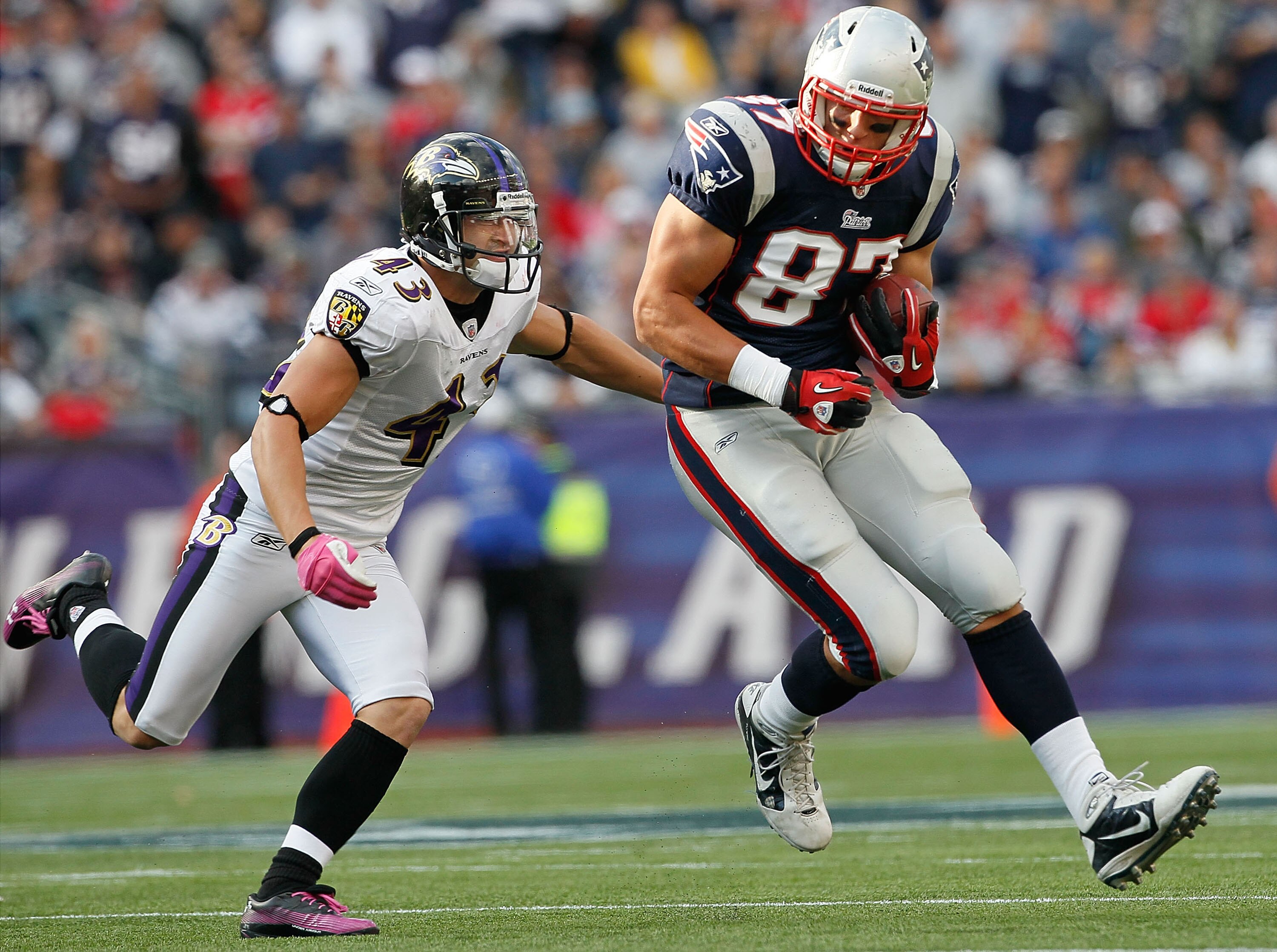 FOXBORO, MA - OCTOBER 17:  Rob Gronkowski #87 of the New England Patriots gains yards as he is chased by Haruki Nakamura #43 of the Baltimore Ravens at Gillette Stadium on October 17, 2010 in Foxboro, Massachusetts. (Photo by Jim Rogash/Getty Images)