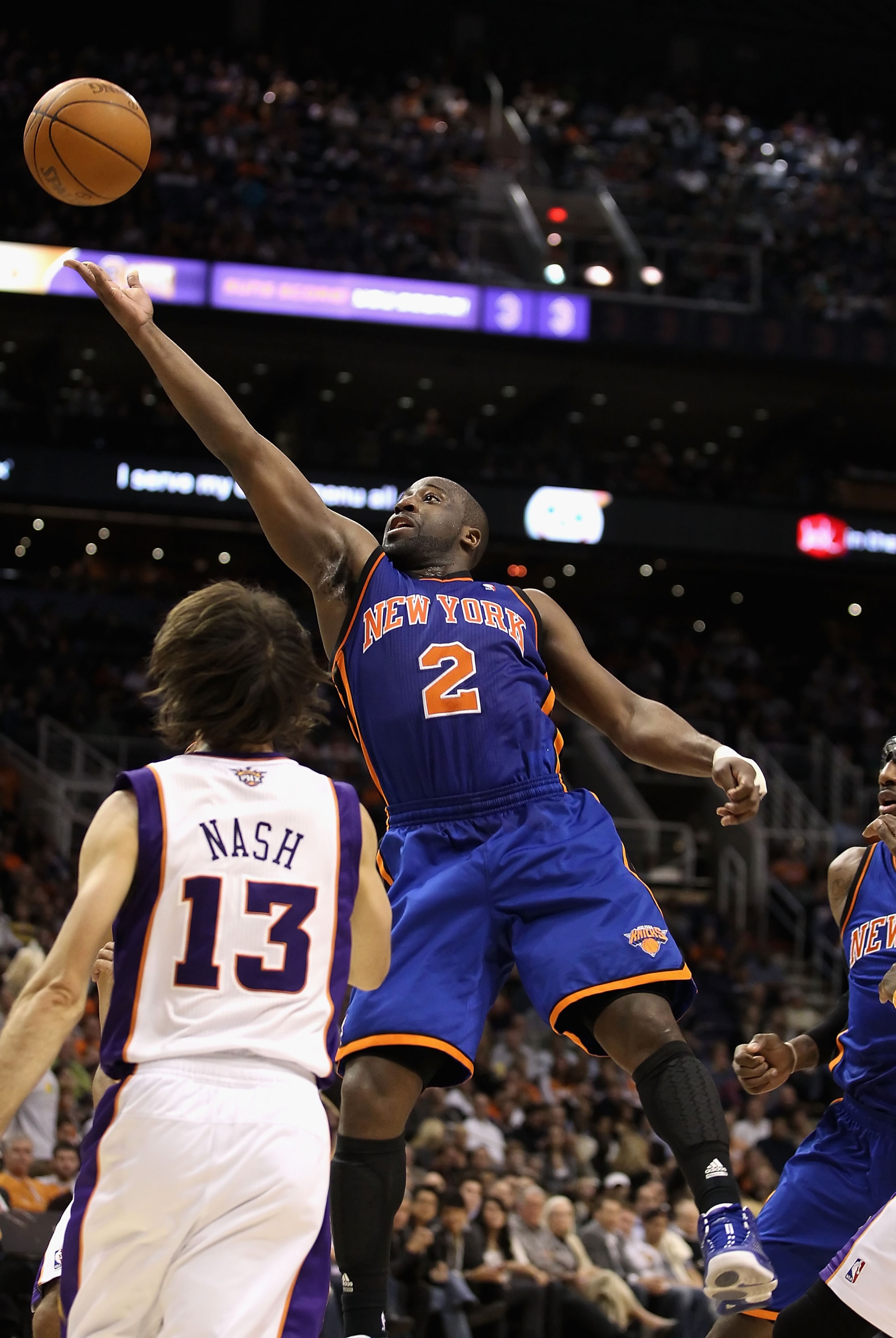 PHOENIX - JANUARY 07:  Raymond Felton #2 of the New York Knicks lays up a shot over Steve Nash #13 of the Phoenix Suns during the NBA game at US Airways Center on January 7, 2011 in Phoenix, Arizona.   The Knicks defeated the Suns 121-96.  NOTE TO USER: U