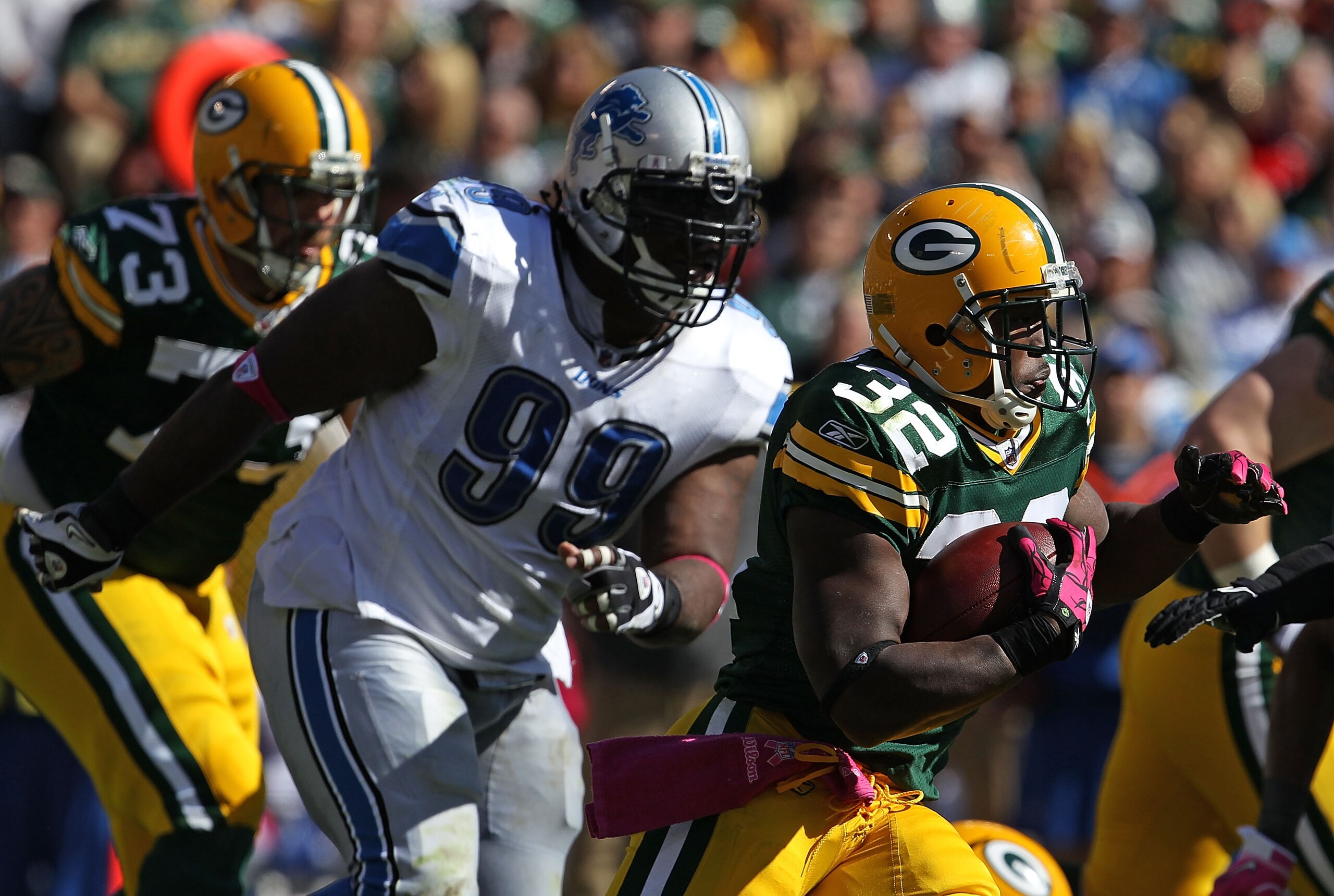 GREEN BAY, WI - OCTOBER 03: Brandon Jackson #32 of the Green Bay Packers rushes pursued by Cory Williams #99 of the Detroit Lions at Lambeau Field on October 3, 2010 in Green Bay, Wisconsin. The Packers defeated the Lions 28-26. (Photo by Jonathan Daniel/ GREEN BAY, WI - OCTOBER 03: Brandon Jackson #32 of the Green Bay Packers rushes pursued by Cory Williams #99 of the Detroit Lions at Lambeau Field on October 3, 2010 in Green Bay, Wisconsin. The Packers defeated the Lions 28-26. (Photo by Jonathan Daniel/