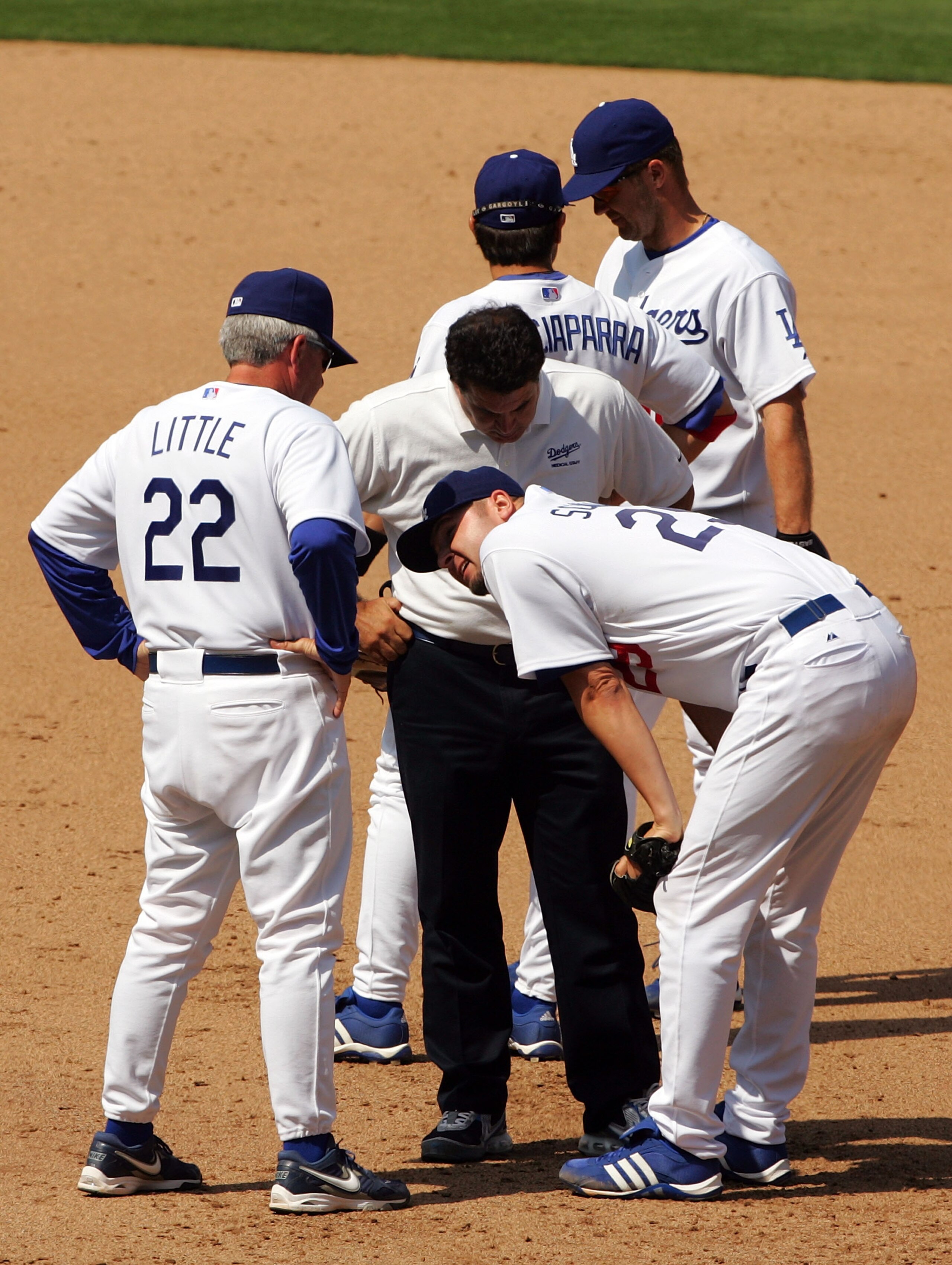 LOS ANGELES, CA - APRIL 09:  Pitcher Jason Schmidt #29 of the Los Angeles Dodgers talks with his manager Grady Little #22 after Schmidt injured his right leg on a play at first base in the 5th inning against the Colorado Rockies on opening day at Dodger S