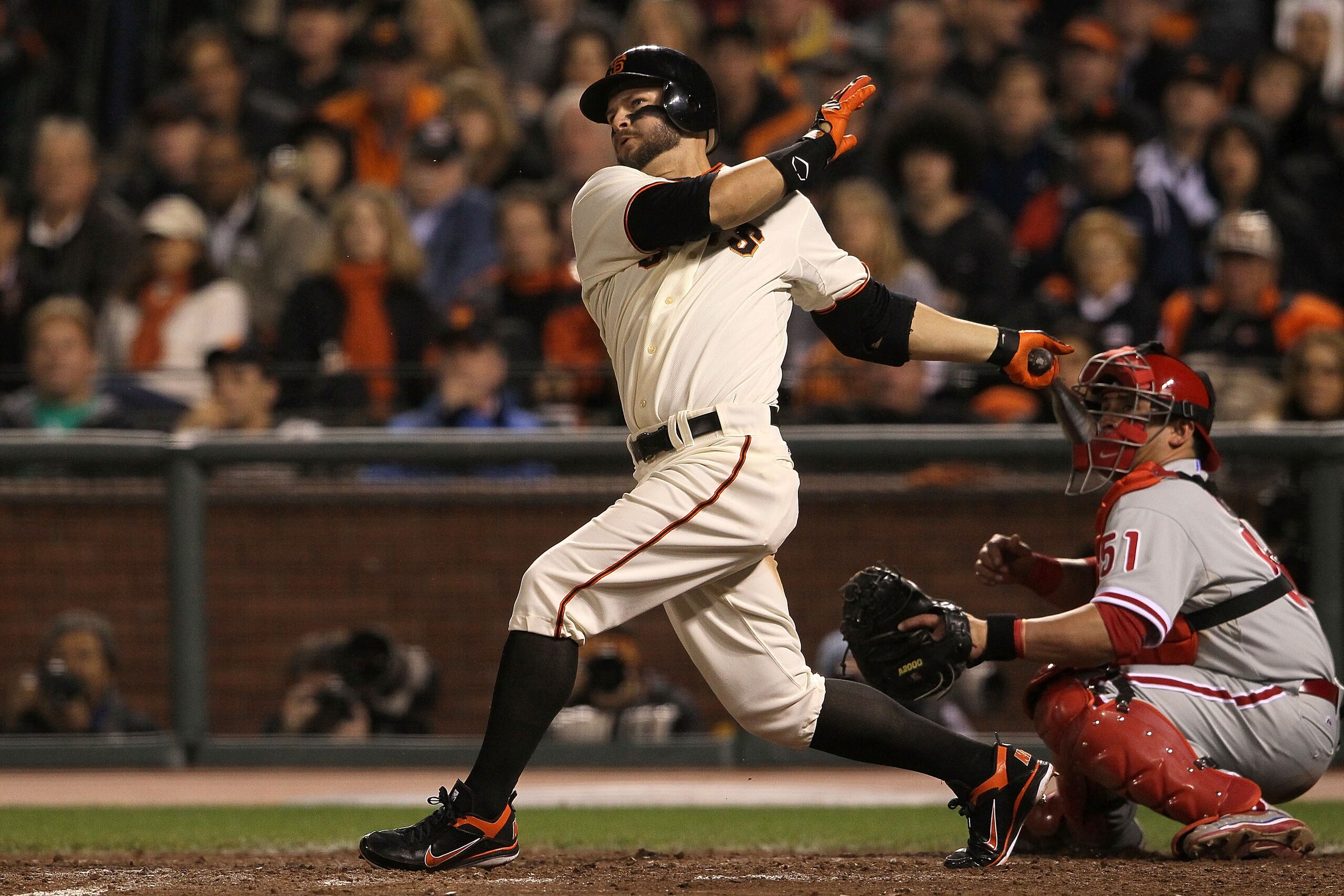 SAN FRANCISCO - OCTOBER 20: Cody Ross #13 of the San Francisco Giants hits a double in the sixth inning against the Philadelphia Phillies in Game Four of the NLCS during the 2010 MLB Playoffs at AT&T Park on October 20, 2010 in San Francisco, California. SAN FRANCISCO - OCTOBER 20: Cody Ross #13 of the San Francisco Giants hits a double in the sixth inning against the Philadelphia Phillies in Game Four of the NLCS during the 2010 MLB Playoffs at AT&T Park on October 20, 2010 in San Francisco, California.