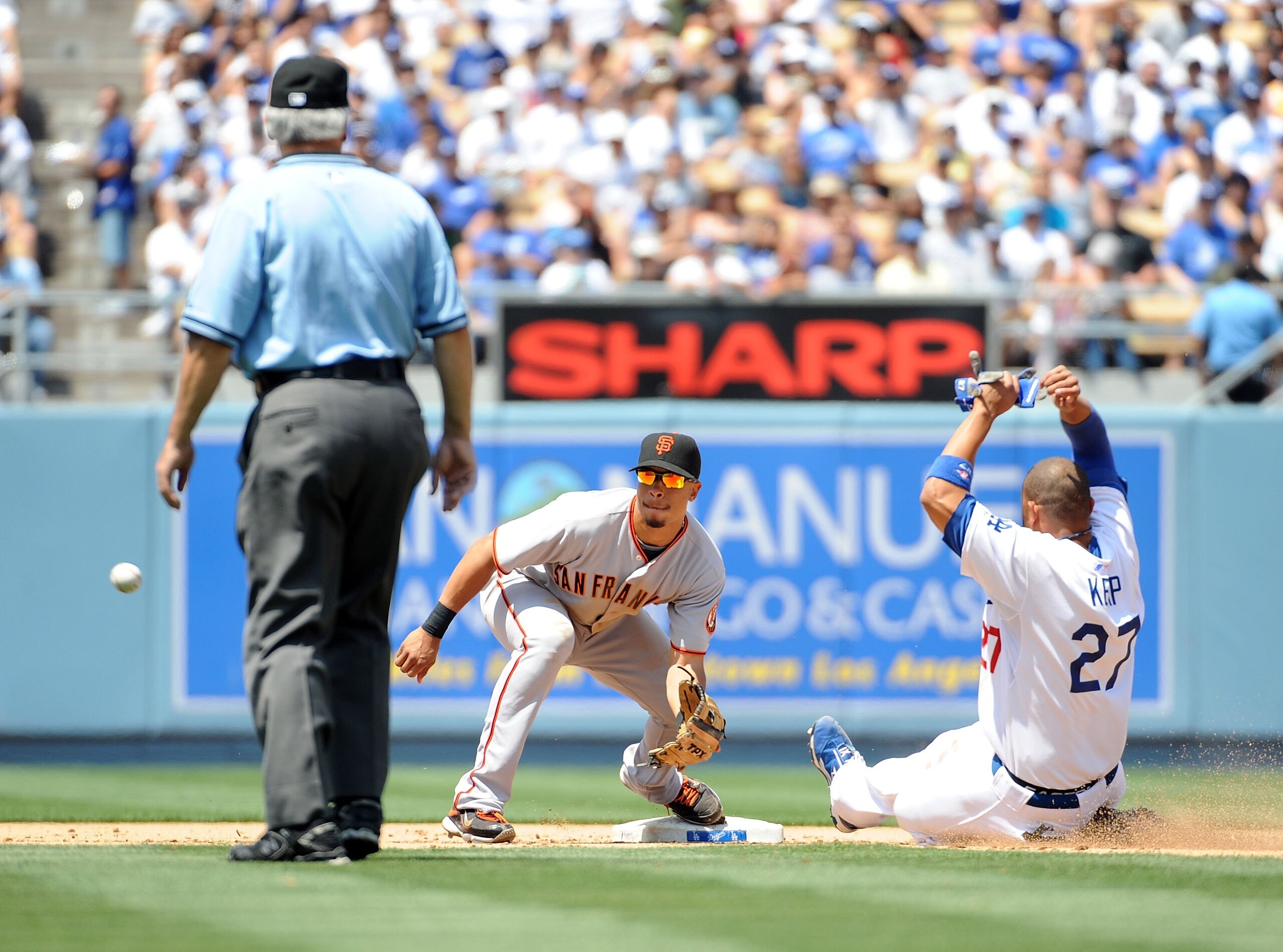 LOS ANGELES, CA - MAY 09:  Matt Kemp #27 of the Los Angeles Dodgers steals second ahead of the tag of Emmanuel Burriss #7 of the San Francicso Giants during the fifth inning at Dodger Stadium on May 9, 2009 in Los Angeles, California.  (Photo by Harry How