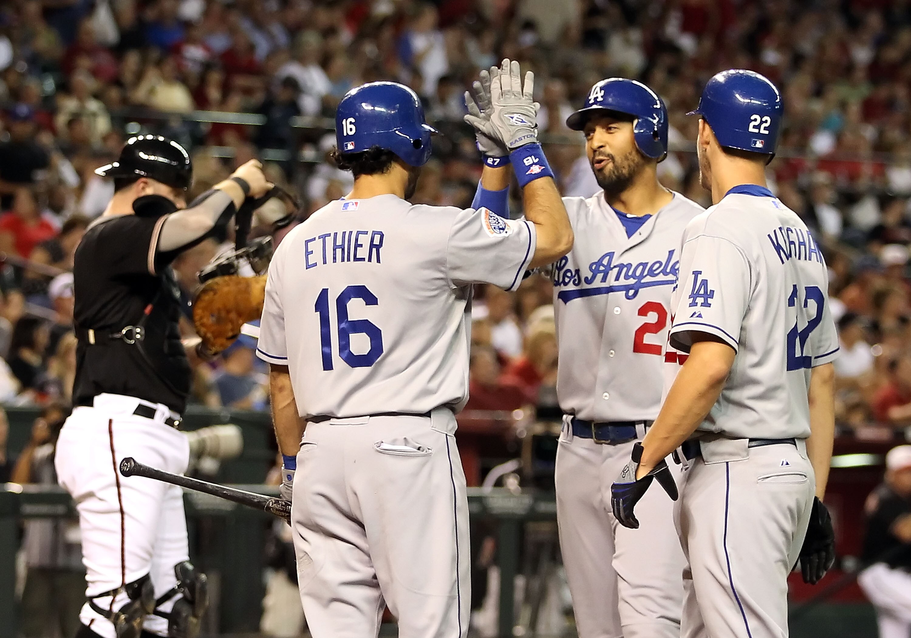 PHOENIX - JULY 03:  Matt Kemp #27 of the Los Angeles Dodgers is congratulated by teammates Andre Ethier #16 and Clayton Kershaw #22 after hitting a 2 run home run against the Arizona Diamondbacks during the second inning of the Major League Baseball game