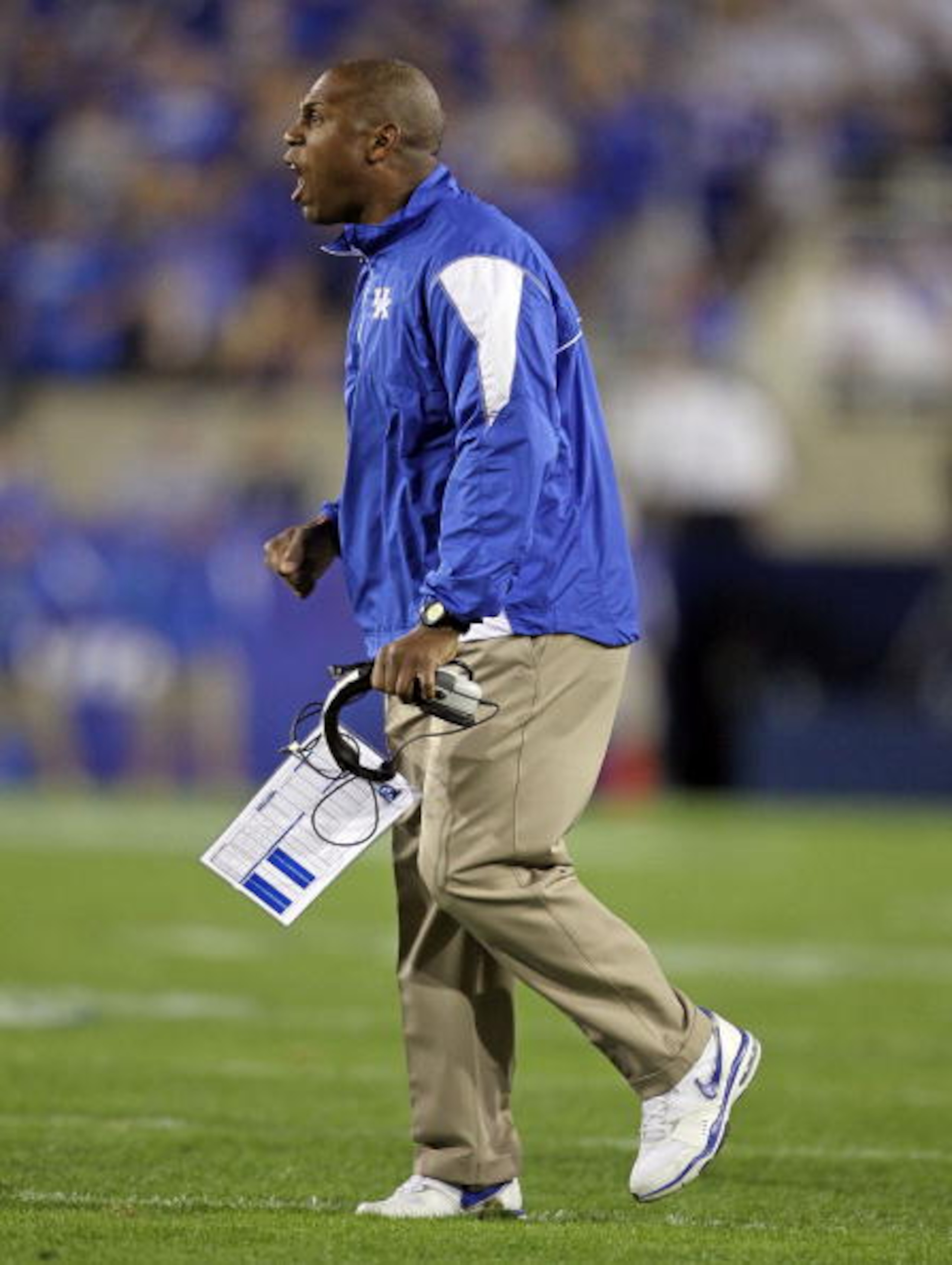 LEXINGTON, KY - OCTOBER 09: Joker Phillips the Head Coach of the Kentucky Wildcats gives instructions to his team during the SEC game against  the Auburn Tigers  at Commonwealth Stadium on October 9, 2010 in Lexington, Kentucky.  (Photo by Andy Lyons/Gett