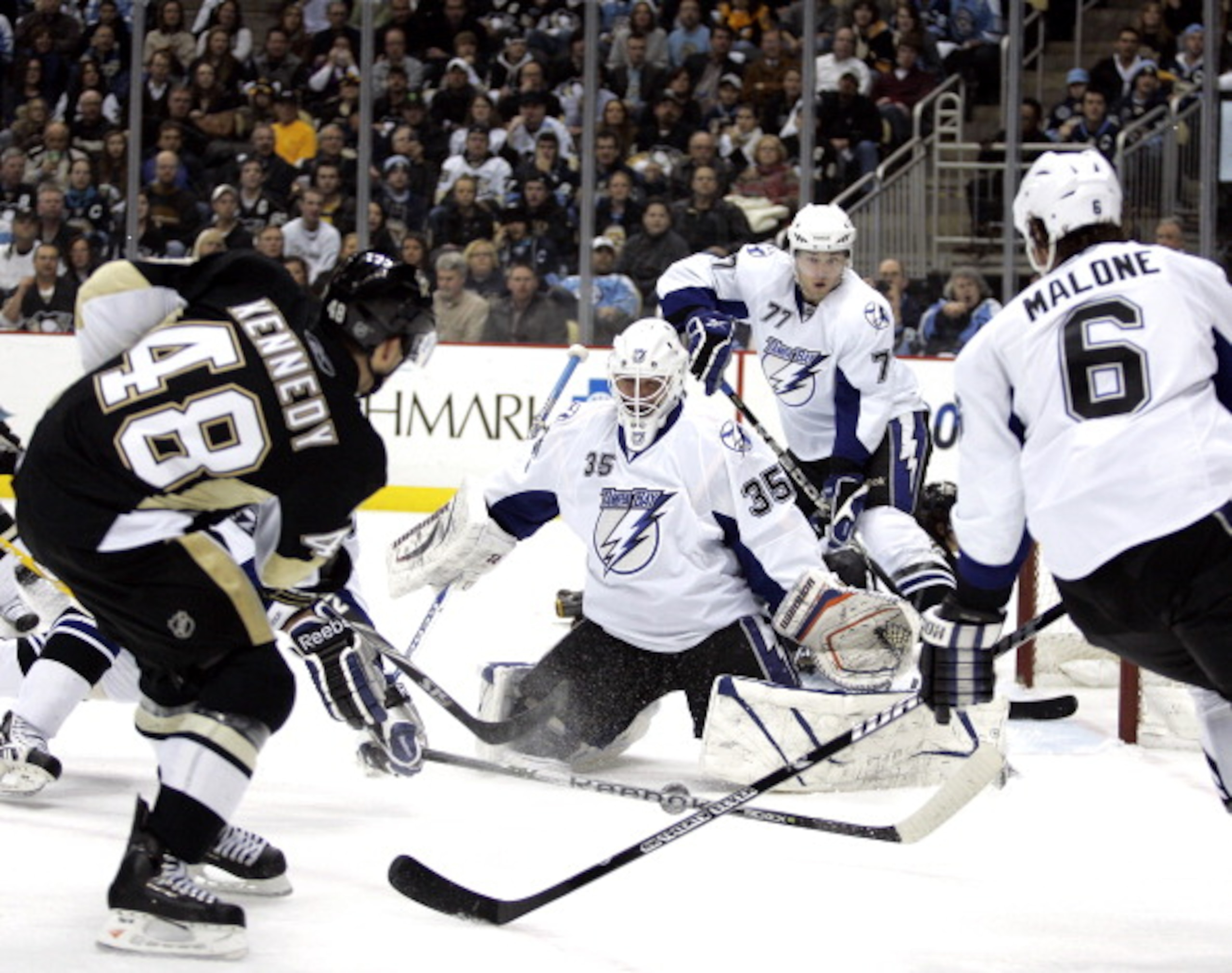 PITTSBURGH, PA - JANUARY 05: Tyler Kennedy #48 of the Pittsburgh Penguins shoots and scores past Dwayne Roloson #35 of the Tampa Bay Lightning on January 5, 2011 at Consol Energy Center in Pittsburgh, Pennsylvania. (Photo by Justin K. Aller/Getty Images PITTSBURGH, PA - JANUARY 05: Tyler Kennedy #48 of the Pittsburgh Penguins shoots and scores past Dwayne Roloson #35 of the Tampa Bay Lightning on January 5, 2011 at Consol Energy Center in Pittsburgh, Pennsylvania. (Photo by Justin K. Aller/Getty Images