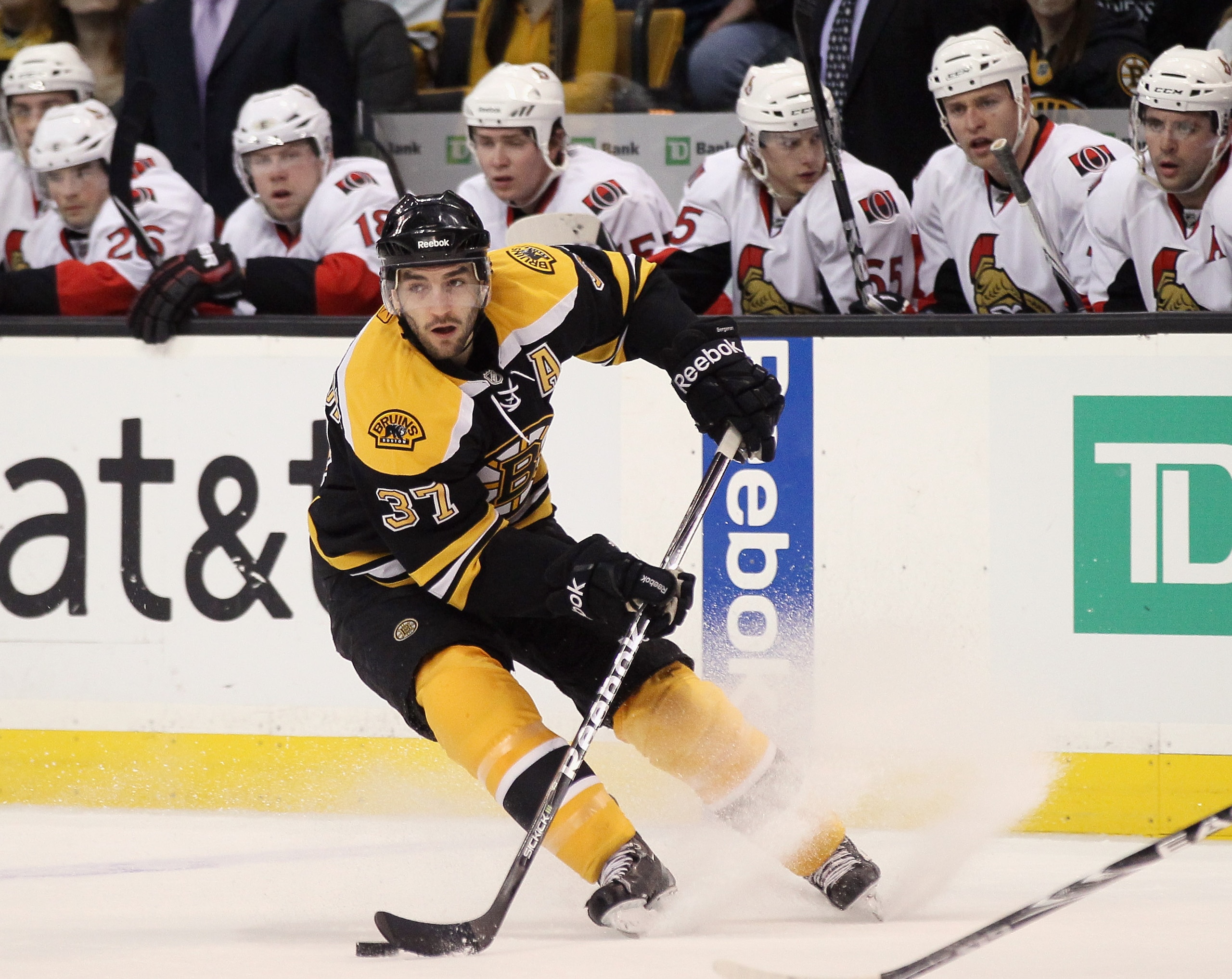 BOSTON, MA - JANUARY 11: Patrice Bergeron #37 of the Boston Bruins takes the puck in the first period against the Ottawa Senators on January 11, 2011 at the TD Garden in Boston, Massachusetts. (Photo by Elsa/Getty Images) BOSTON, MA - JANUARY 11: Patrice Bergeron #37 of the Boston Bruins takes the puck in the first period against the Ottawa Senators on January 11, 2011 at the TD Garden in Boston, Massachusetts. (Photo by Elsa/Getty Images)