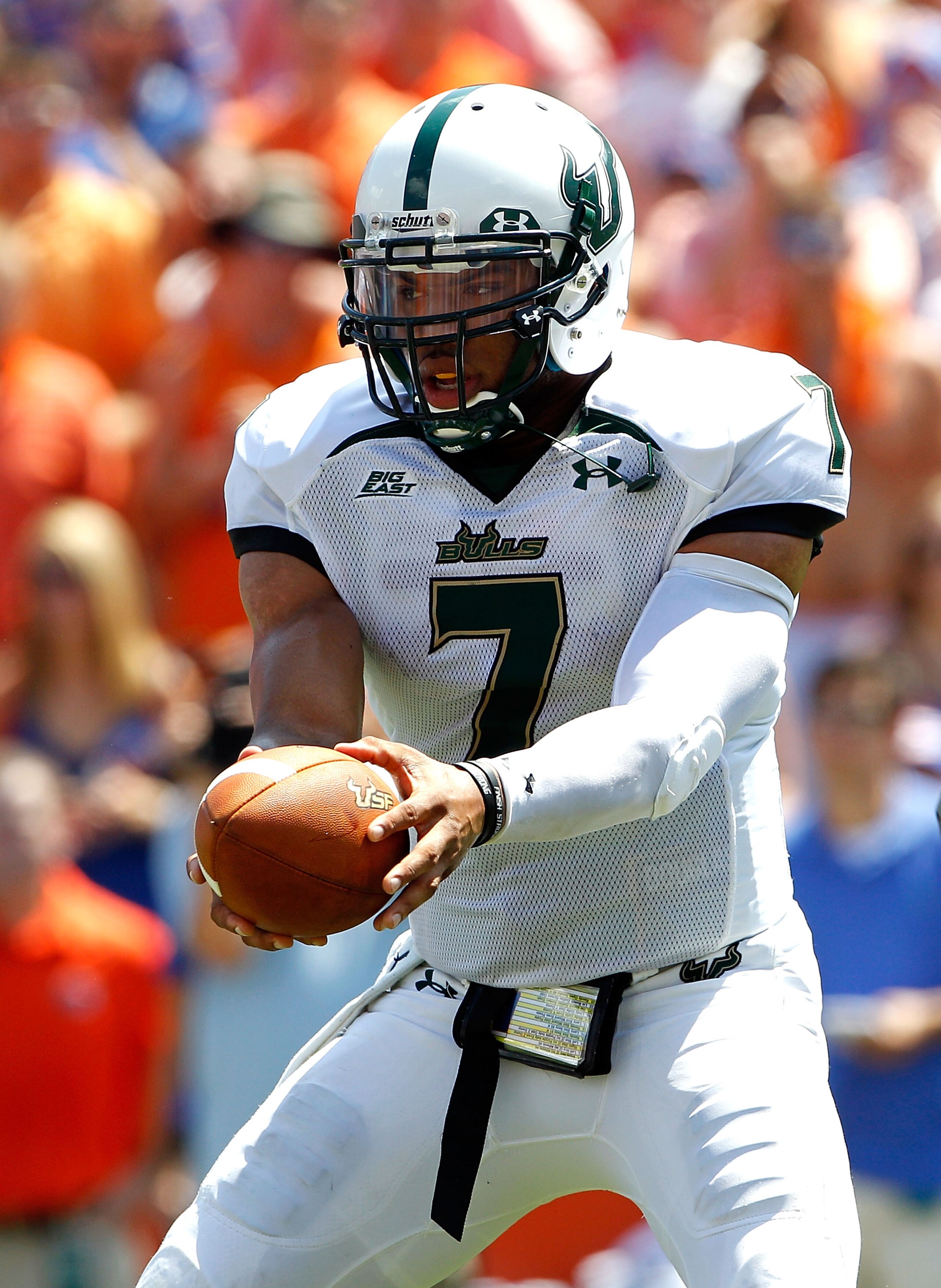 GAINESVILLE, FL - SEPTEMBER 11:  Quarterback B.J. Daniels #7 of the South Florida Bulls attempts a handoff during a game against the Florida Gators at Ben Hill Griffin Stadium on September 11, 2010 in Gainesville, Florida.  (Photo by Sam Greenwood/Getty I