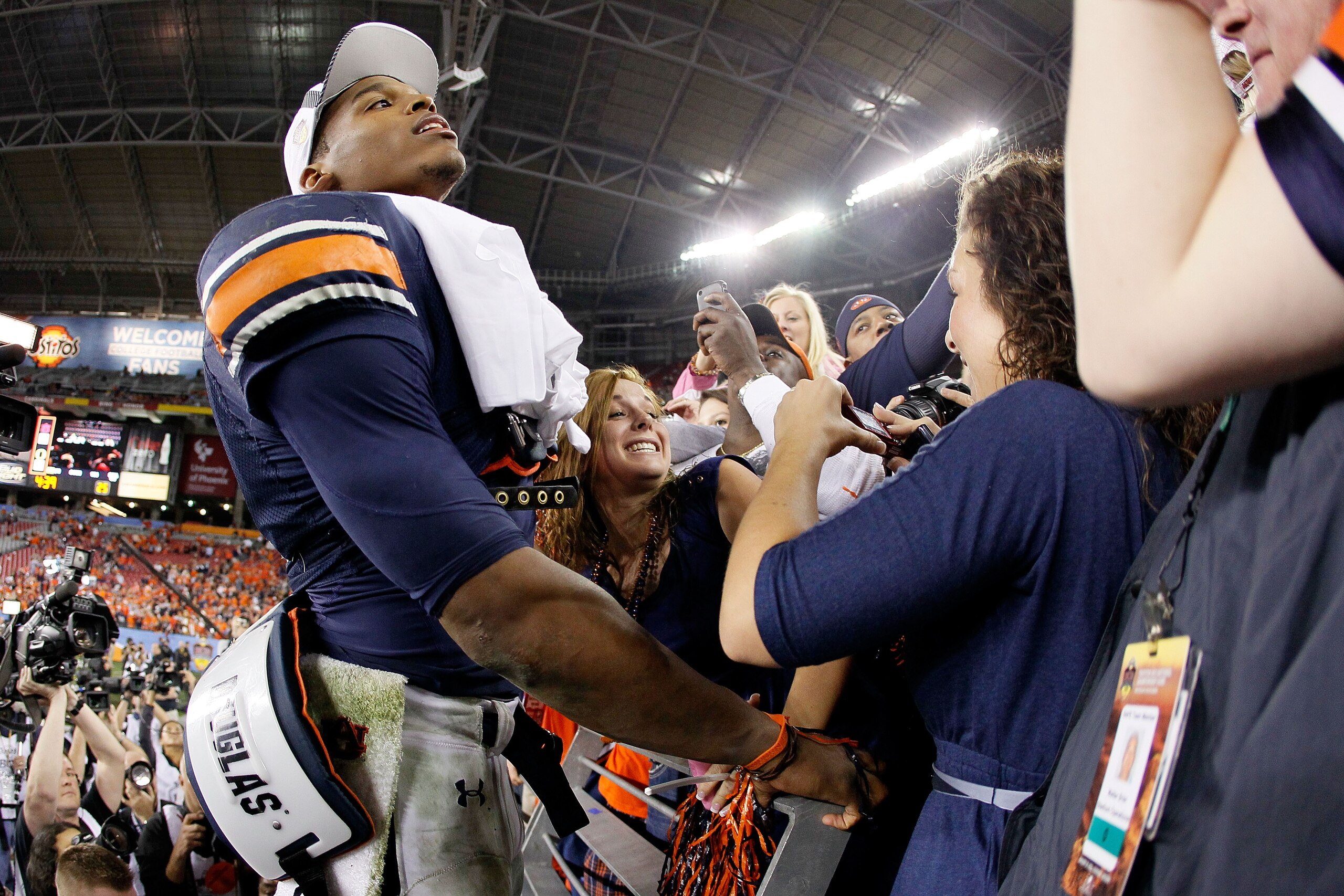 GLENDALE, AZ - JANUARY 10: Quarterback Cameron Newton #2 of the Auburn Tigers celebrates the Tigers 22-19 victory against the Oregon Ducks in the Tostitos BCS National Championship Game at University of Phoenix Stadium on January 10, 2011 in Glendale, Ar GLENDALE, AZ - JANUARY 10: Quarterback Cameron Newton #2 of the Auburn Tigers celebrates the Tigers 22-19 victory against the Oregon Ducks in the Tostitos BCS National Championship Game at University of Phoenix Stadium on January 10, 2011 in Glendale, Ar