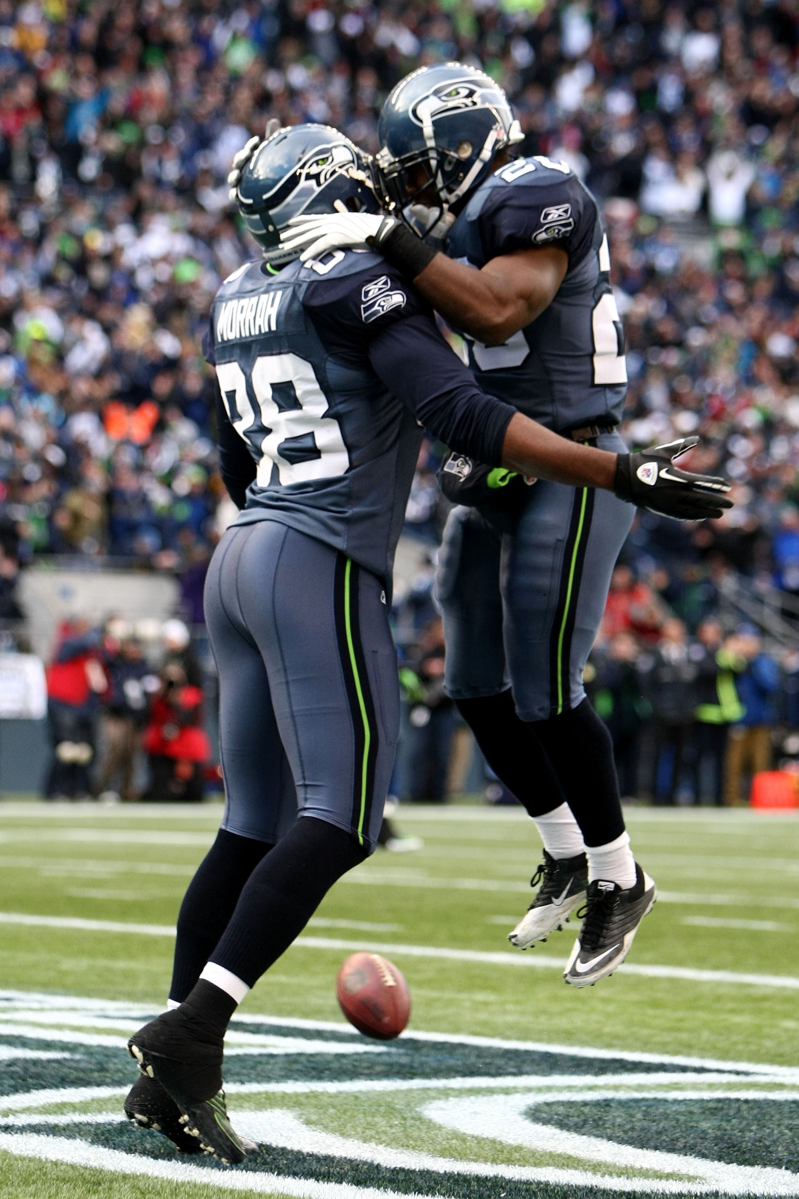 SEATTLE, WA - JANUARY 08:  Cameron Morrah #88 celebrates with Justin Forsett #20 of the Seattle Seahawks against the New Orleans Saints during the 2011 NFC wild-card playoff game at Qwest Field on January 8, 2011 in Seattle, Washington.  (Photo by Jonatha