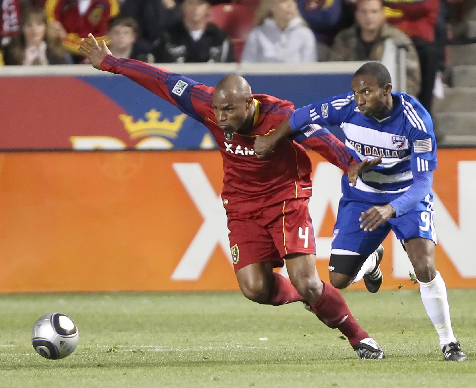 SANDY, UT - NOVEMBER 6: Jamison Olave #4 of Real Salt Lake and Jeff Cunningham #9 of FC Dallas fight for the ball during the first half of an MLS play off  game November 6, 2010 at Rio Tinto Stadium in Sandy, Utah.(Photo by George Frey/Getty Images)