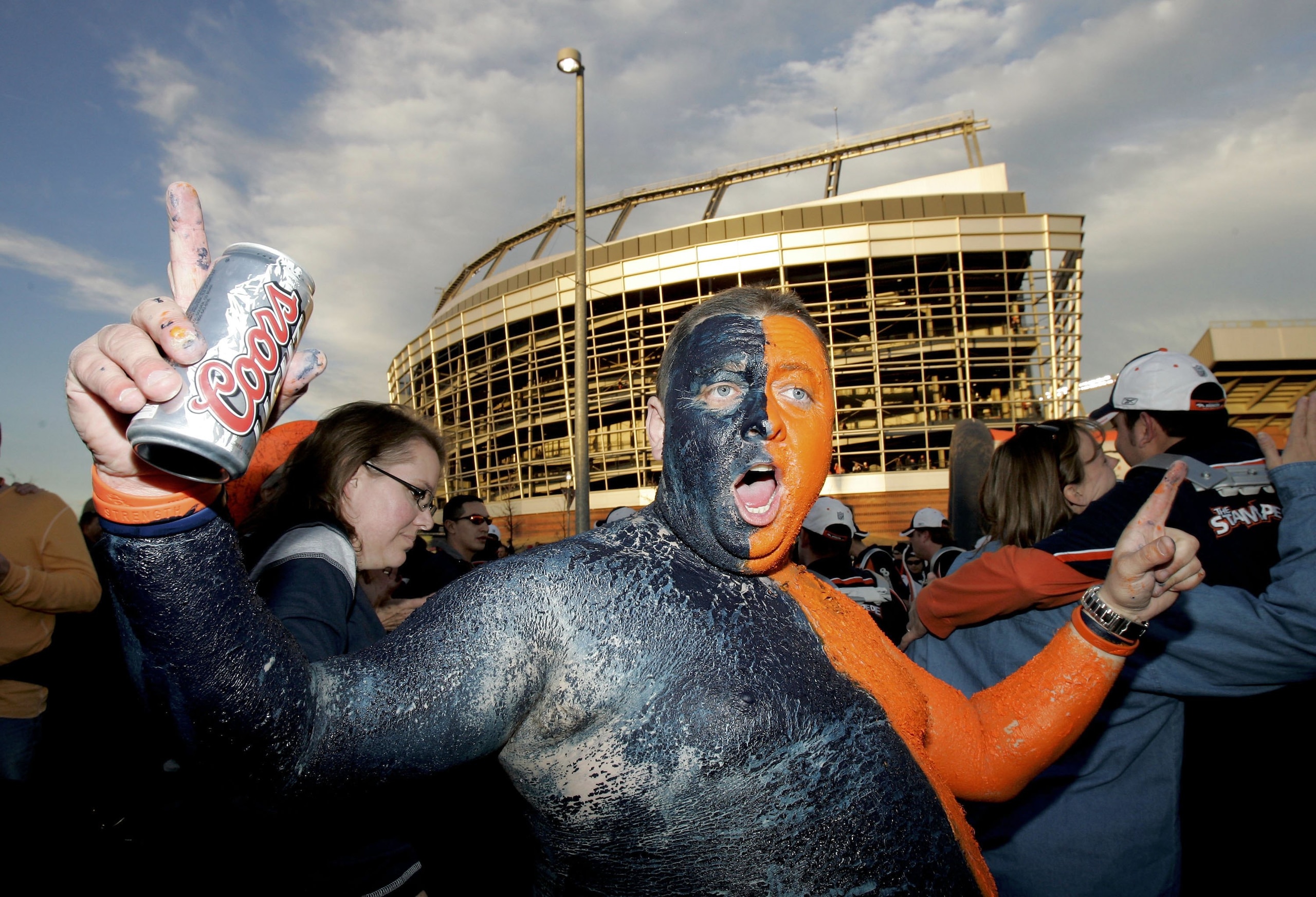 DENVER - JANUARY 14:  Jeremy Martin, a Denver Broncos fan, cheers on his team outside Invesco Field before the AFC Divisional Playoff game against the New England Patriots on January 14, 2006 at Invesco Field at Mile High in Denver, Colorado.  (Photo by B