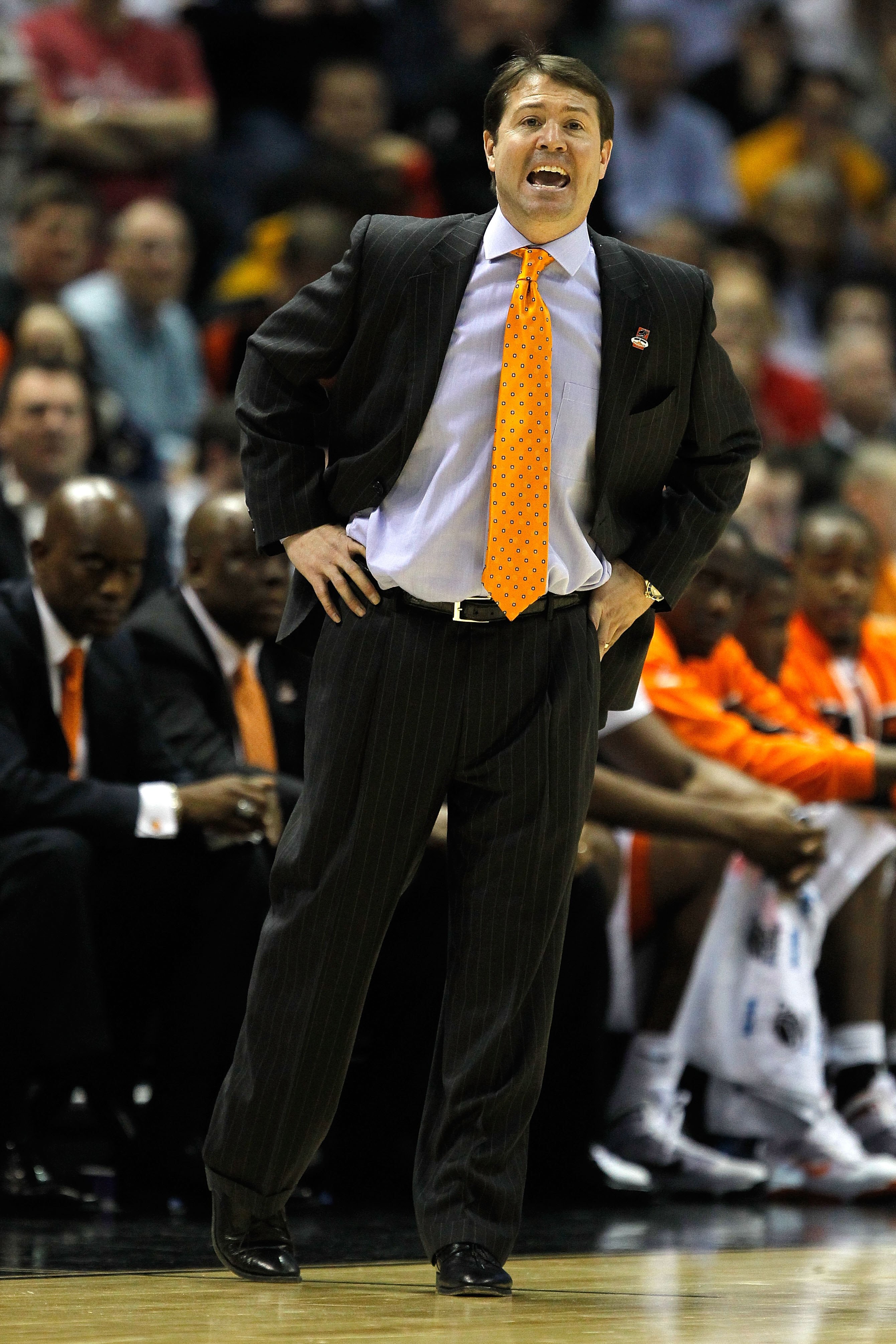MILWAUKEE - MARCH 19:  Head coach Travis Ford of the Oklahoma State Cowboys looks on while taking on the Georgia Tech Yellow Jackets during the first round of the 2010 NCAA men's basketball tournament at the Bradley Center on March 19, 2010 in Milwaukee,