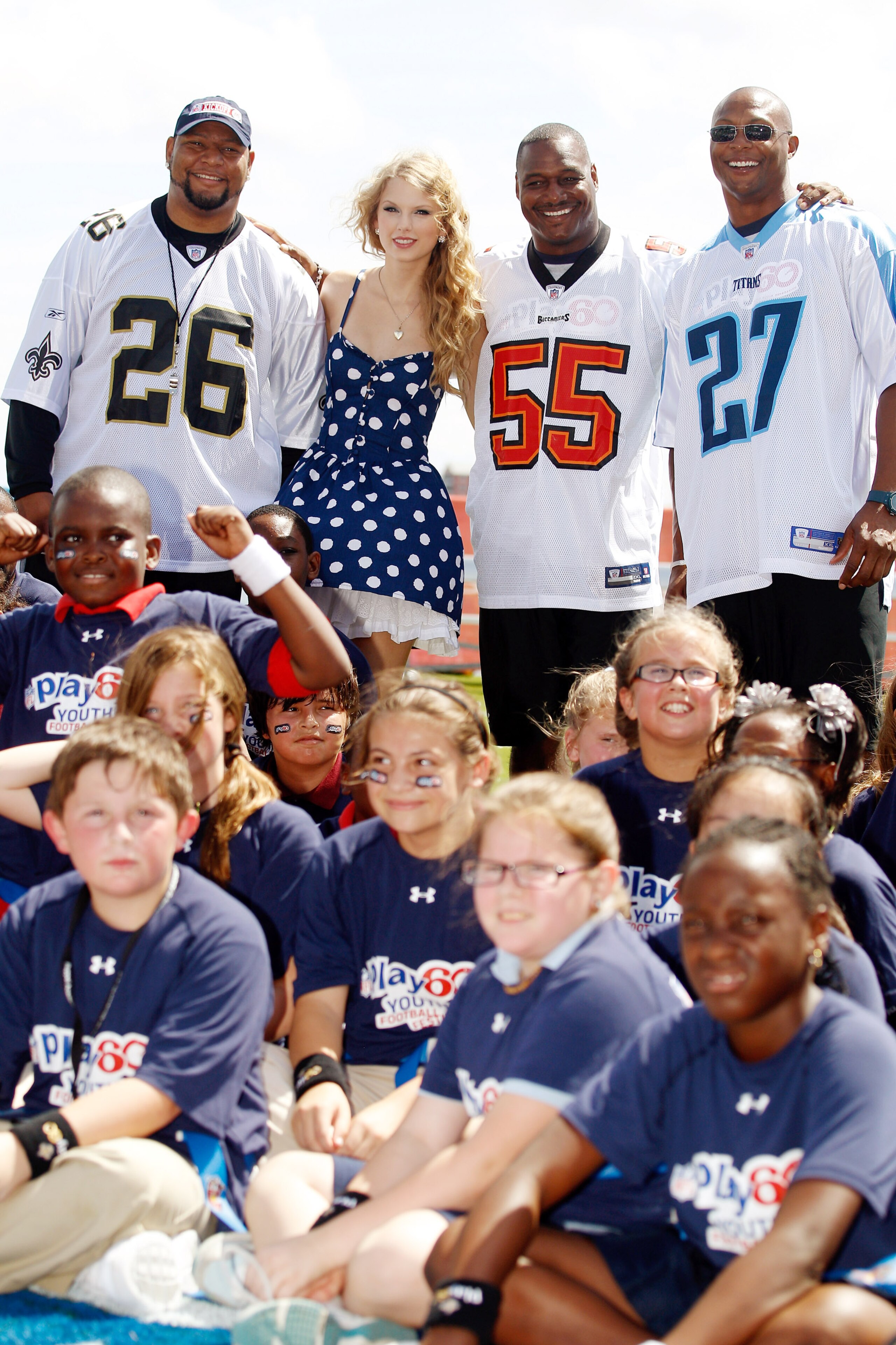 NEW ORLEANS - SEPTEMBER 08:  From left, Deuce McAllister, Taylor Swift, Derrick Brooks, and Eddie George pose for a photo during the NFLï¿½s Play 60 campaign to fight childhood obesity on September 8, 2010 in New Orleans, Louisiana.  (Photo by Chris Graythe