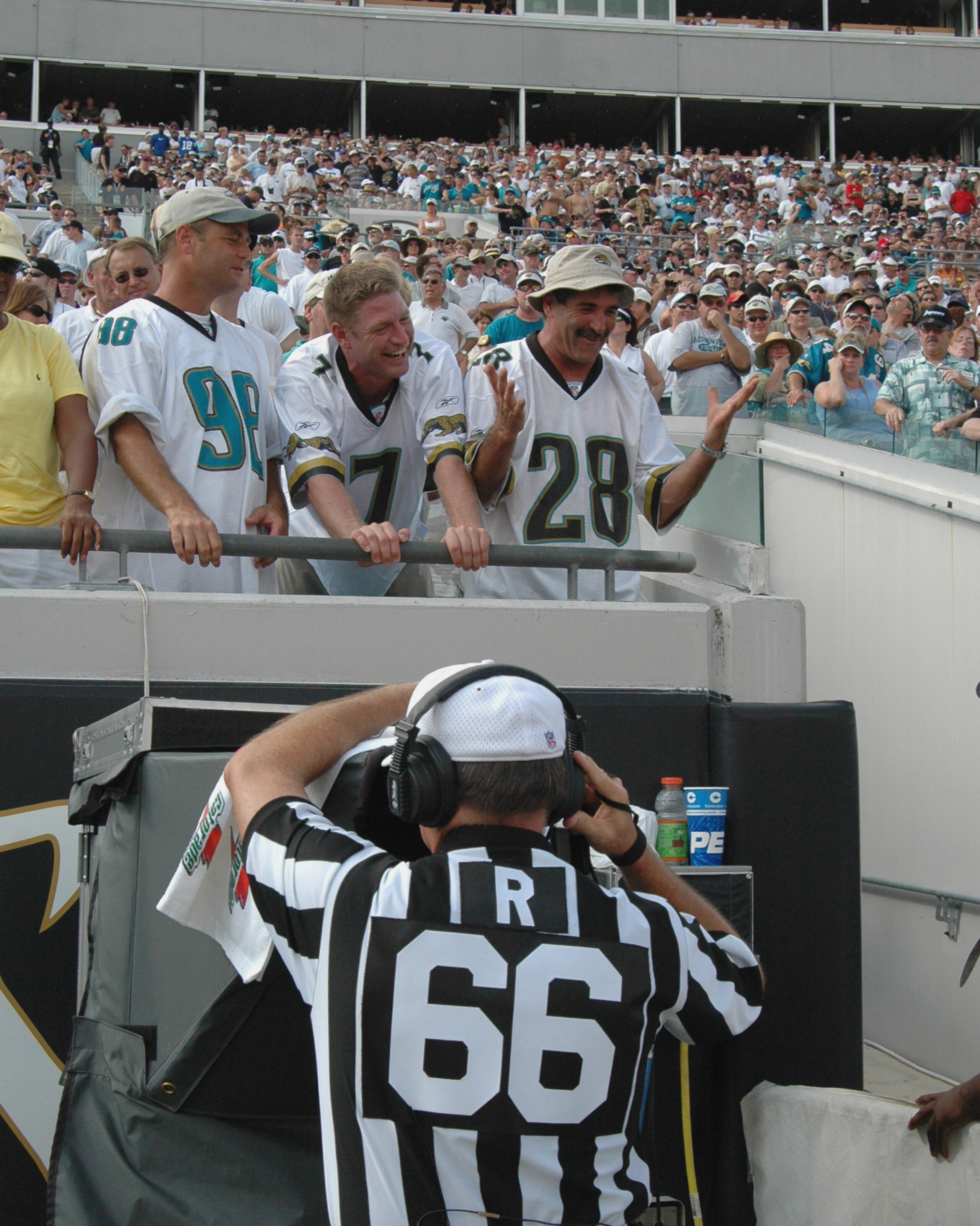 NFL referee Walt Anbderson checks a replay as fans offer words of advice   at Alltel Stadium, Jacksonville, Florida, October 3, 2004.  (Photo by Al Messerschmidt/Getty Images)