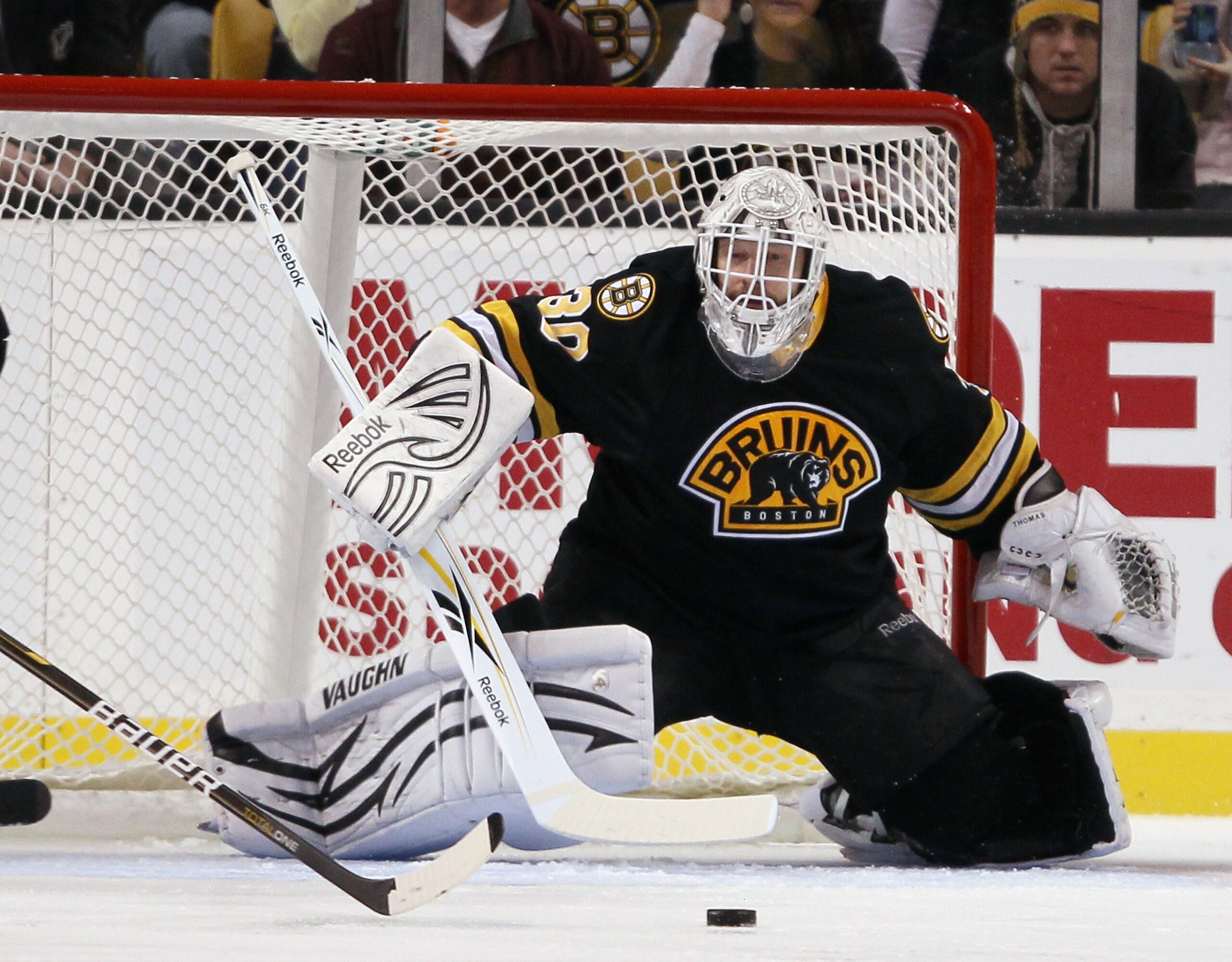 BOSTON - NOVEMBER 26:  Tim Thomas #30 of the Boston Bruins stops a shot in the first period against the Carolina Hurricanes on November 26, 2010 at the TD Garden in Boston, Massachusetts.  (Photo by Elsa/Getty Images)
