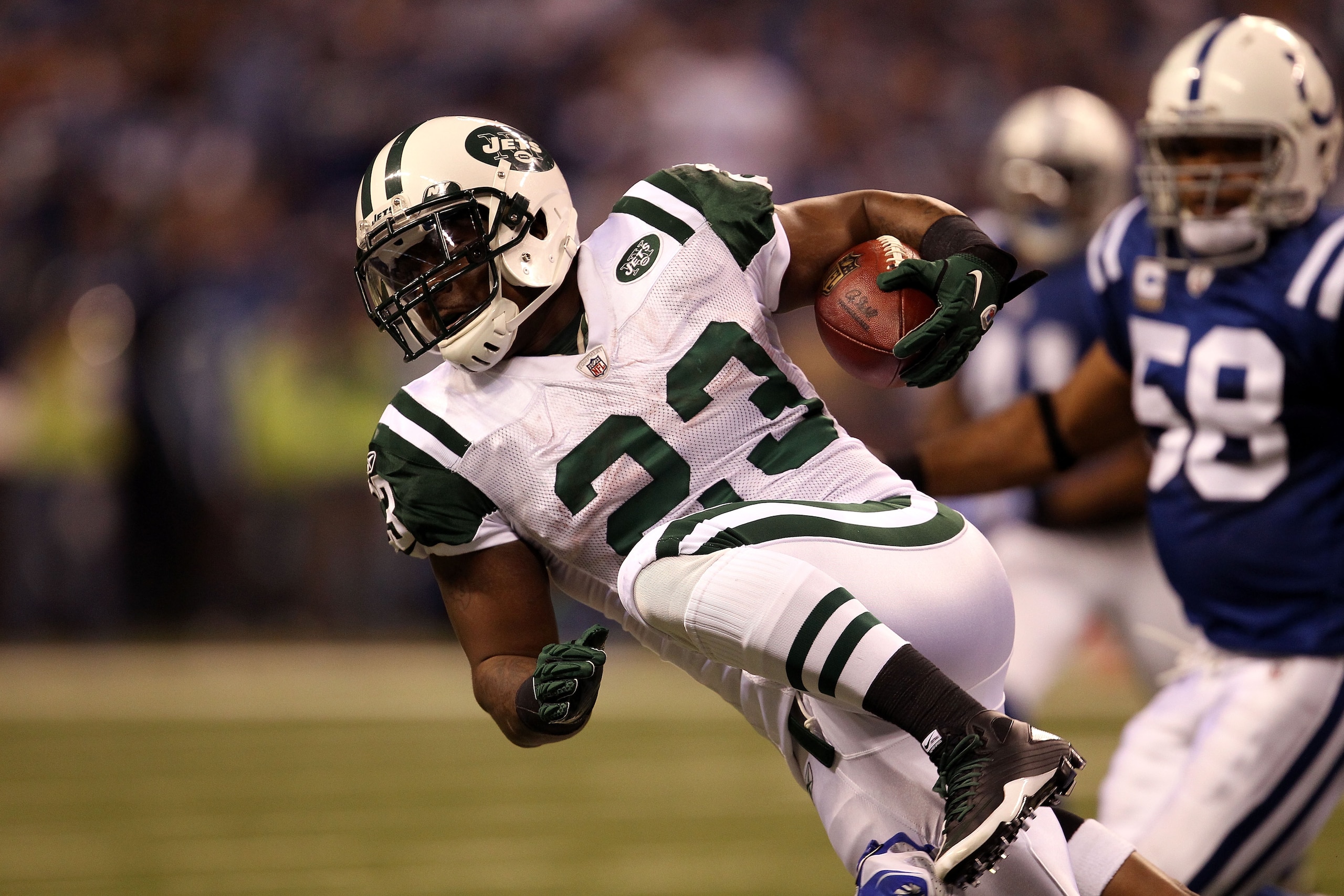 INDIANAPOLIS, IN - JANUARY 08:  Shonn Greene #23 of the New York Jets runs the ball against the Indianapolis Colts during their 2011 AFC wild card playoff game at Lucas Oil Stadium on January 8, 2011 in Indianapolis, Indiana. The Jets won 17-16.  (Photo b