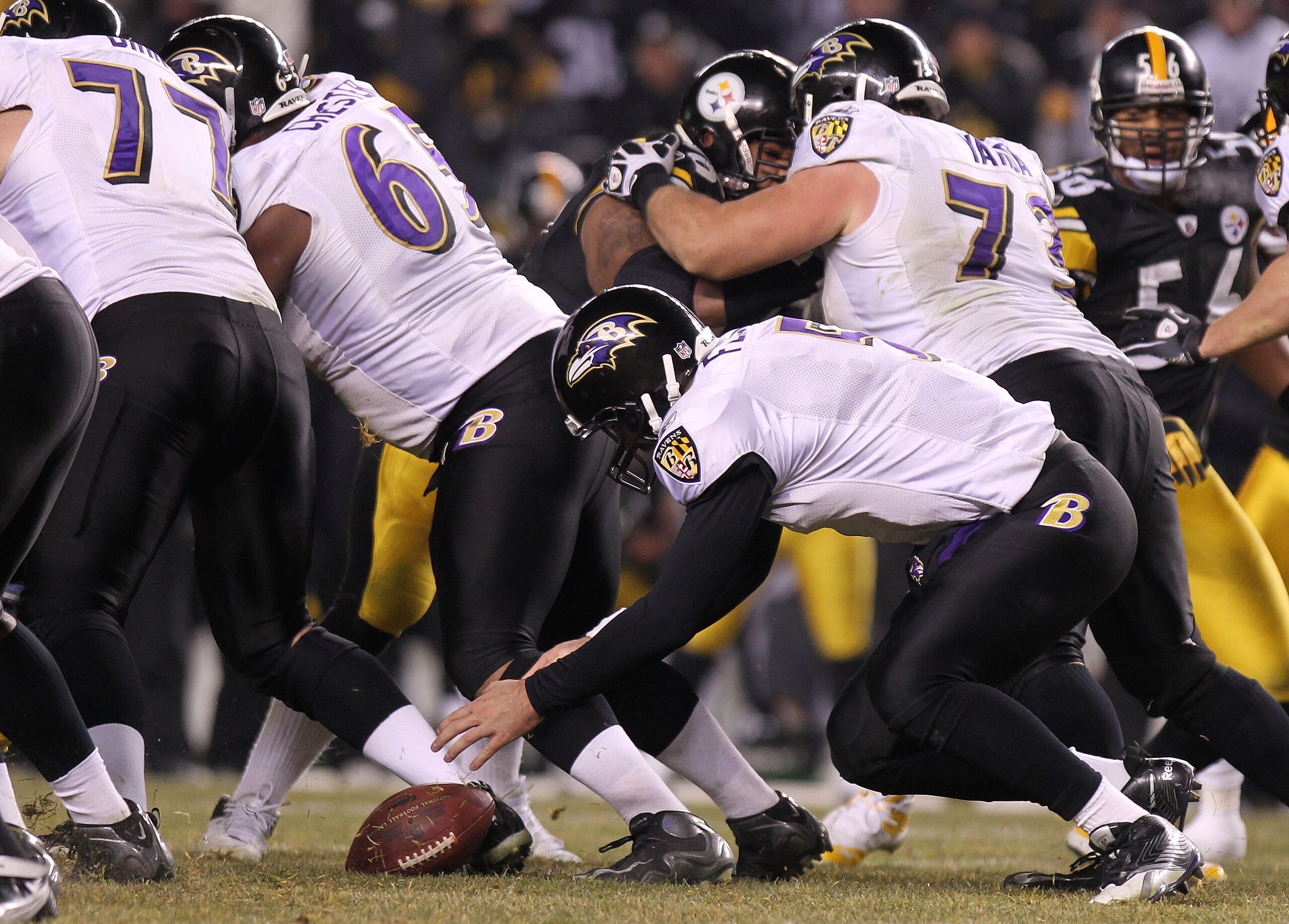 PITTSBURGH, PA - JANUARY 15:  Quarterback Joe Flacco #5 of the Baltimore Ravens fumbles the ball in the third quarter of the AFC Divisional Playoff Game against the Pittsburgh Steelers at Heinz Field on January 15, 2011 in Pittsburgh, Pennsylvania.  (Phot