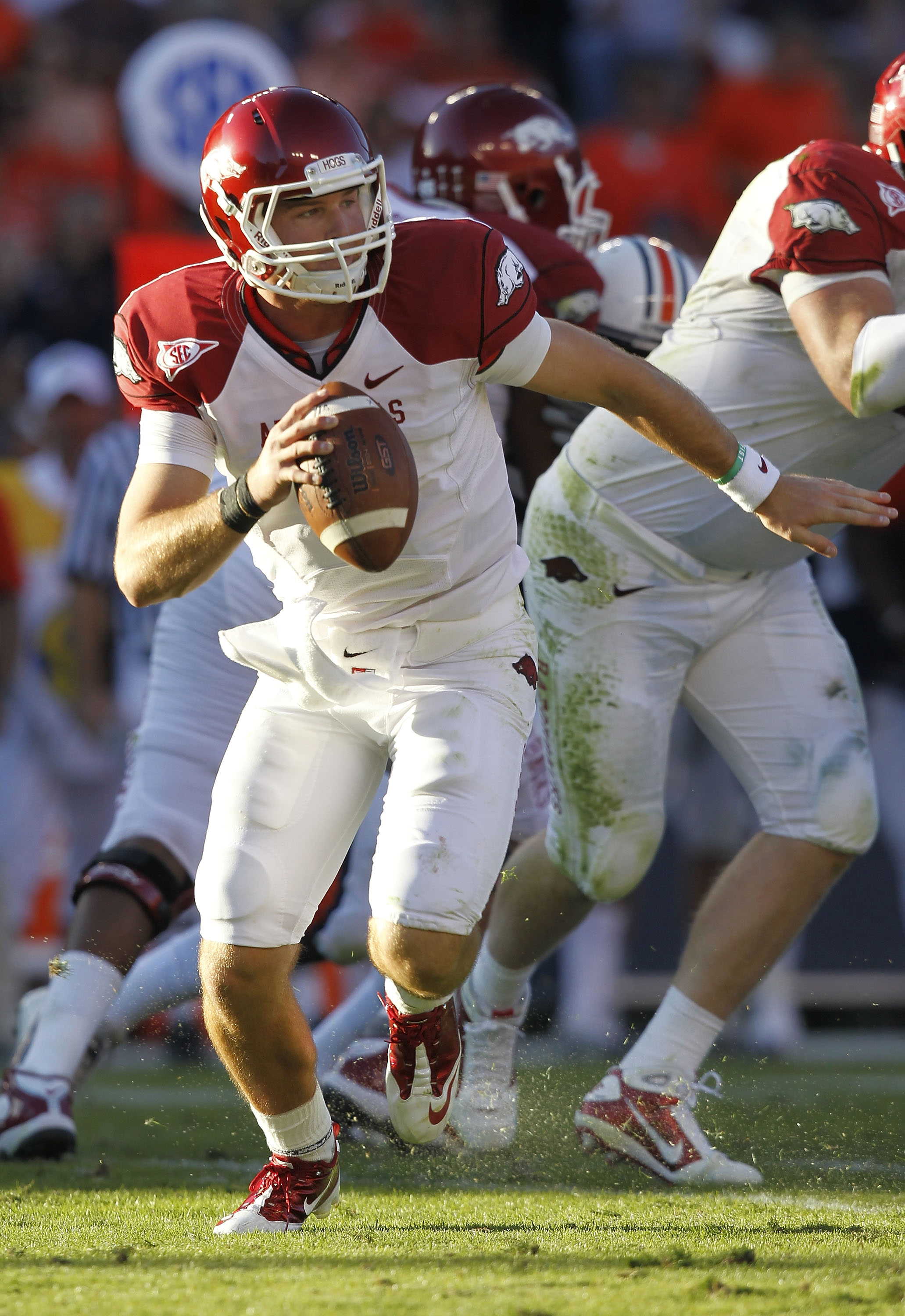AUBURN - OCTOBER 16:  Quarterback Tyler Wilson #8 of the Arkansas Razorbacks rolls out during the game against the Auburn Tigers at Jordan-Hare Stadium on October 16, 2010 in Auburn, Alabama.  The Tigers beat the Razorbacks 65-43.  (Photo by Mike Zarrilli