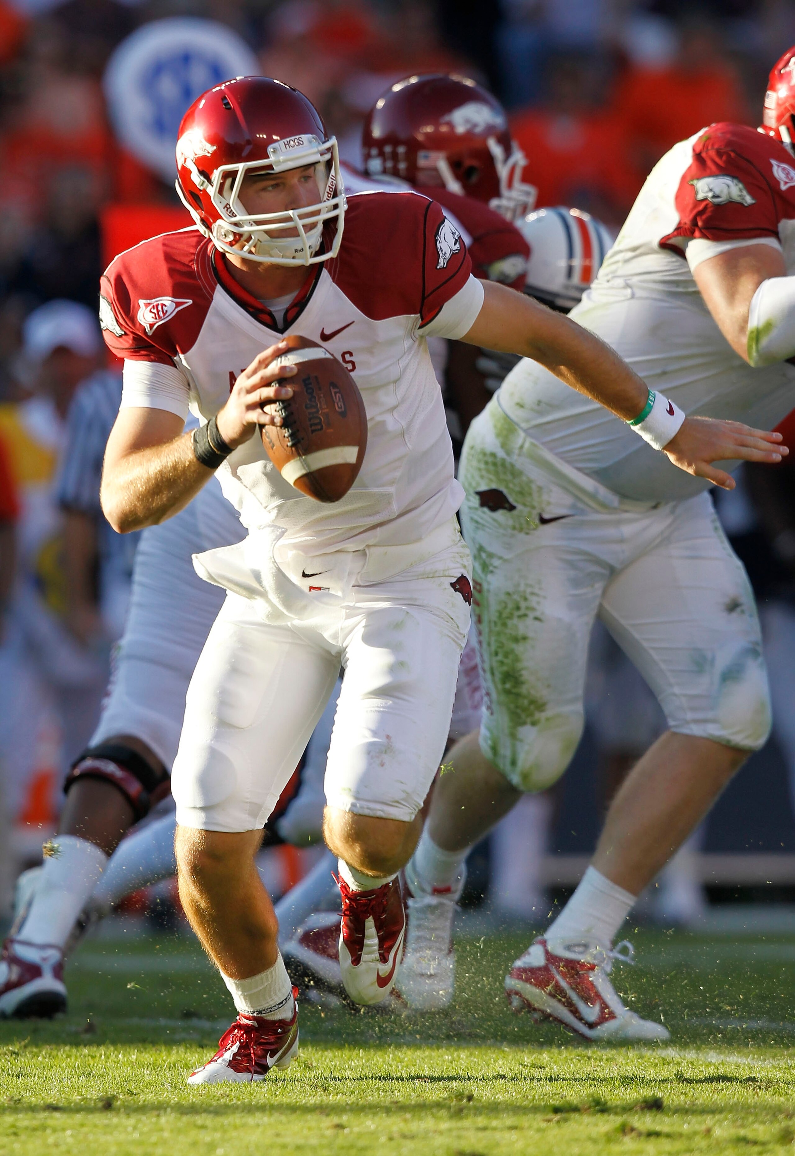 AUBURN - OCTOBER 16:  Quarterback Tyler Wilson #8 of the Arkansas Razorbacks rolls out during the game against the Auburn Tigers at Jordan-Hare Stadium on October 16, 2010 in Auburn, Alabama.  The Tigers beat the Razorbacks 65-43.  (Photo by Mike Zarrilli