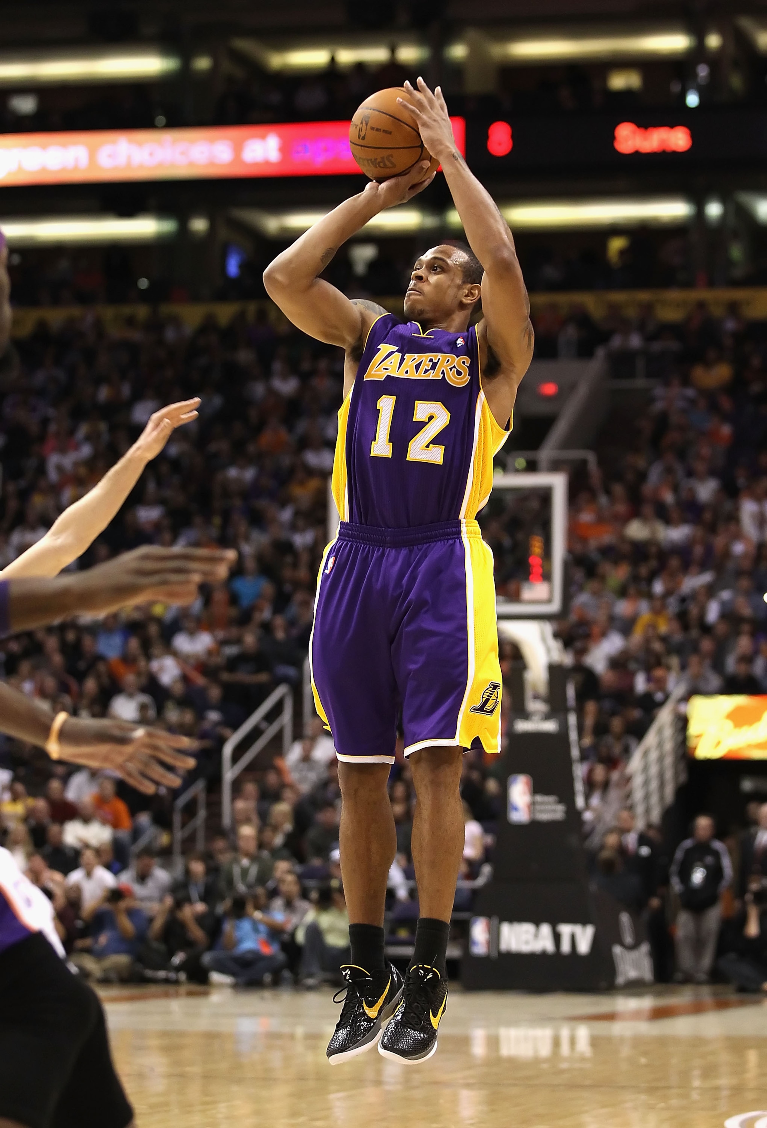 PHOENIX - JANUARY 05: Shannon Brown #12 of the Los Angeles Lakers attempts a three point shot agianst the Phoenix Suns during the NBA game at US Airways Center on January 5, 2011 in Phoenix, Arizona. The Lakers defeated the Suns 99-95. NOTE TO USER: User