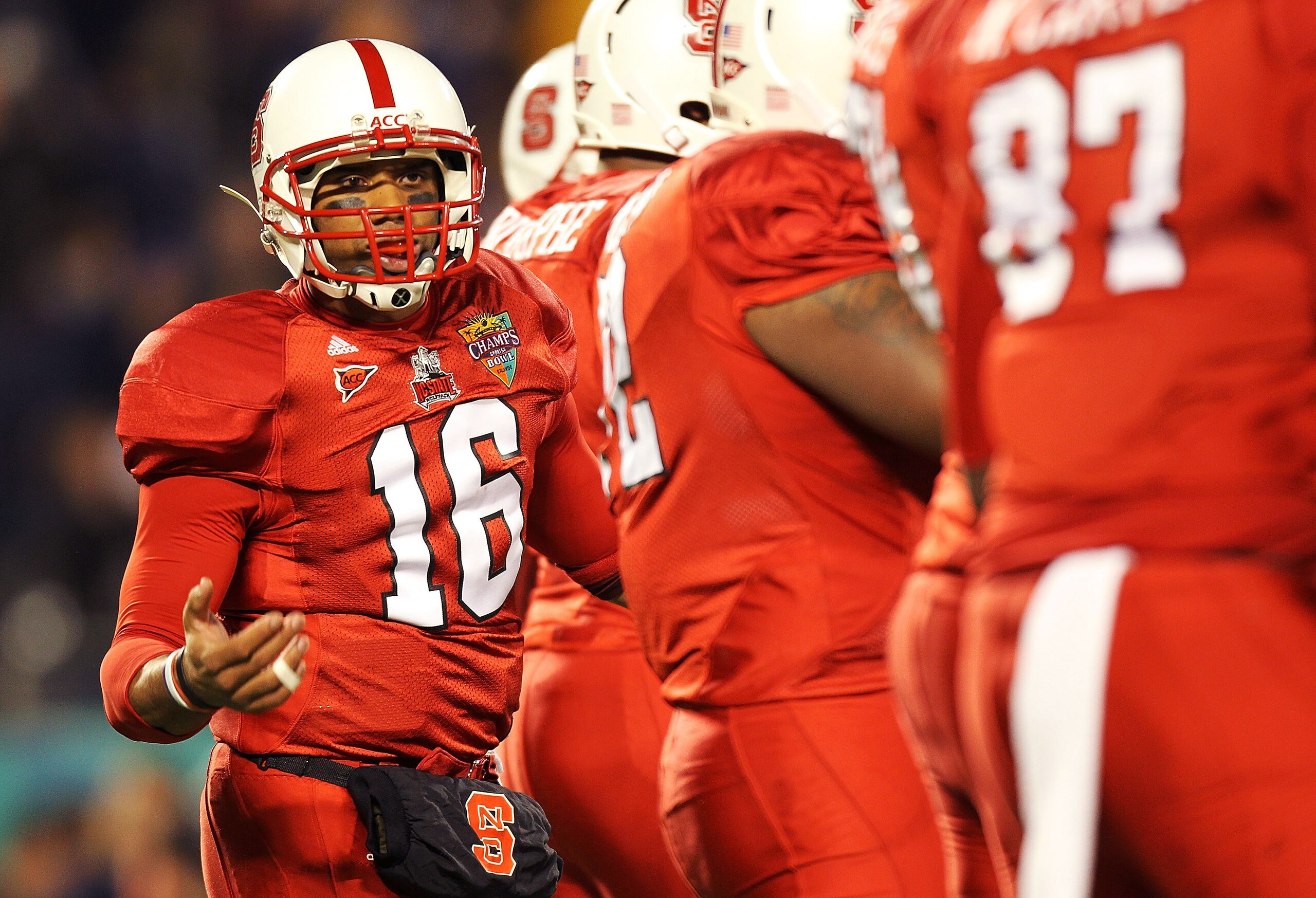 ORLANDO, FL - DECEMBER 28:  Russell Wilson #16 of the North Carolina State Wolfpack calls a play during the Champs Sports Bowl against the West Virginia Mountineers at Florida Citrus Bowl Stadium on December 28, 2010 in Orlando, Florida.  (Photo by Mike E