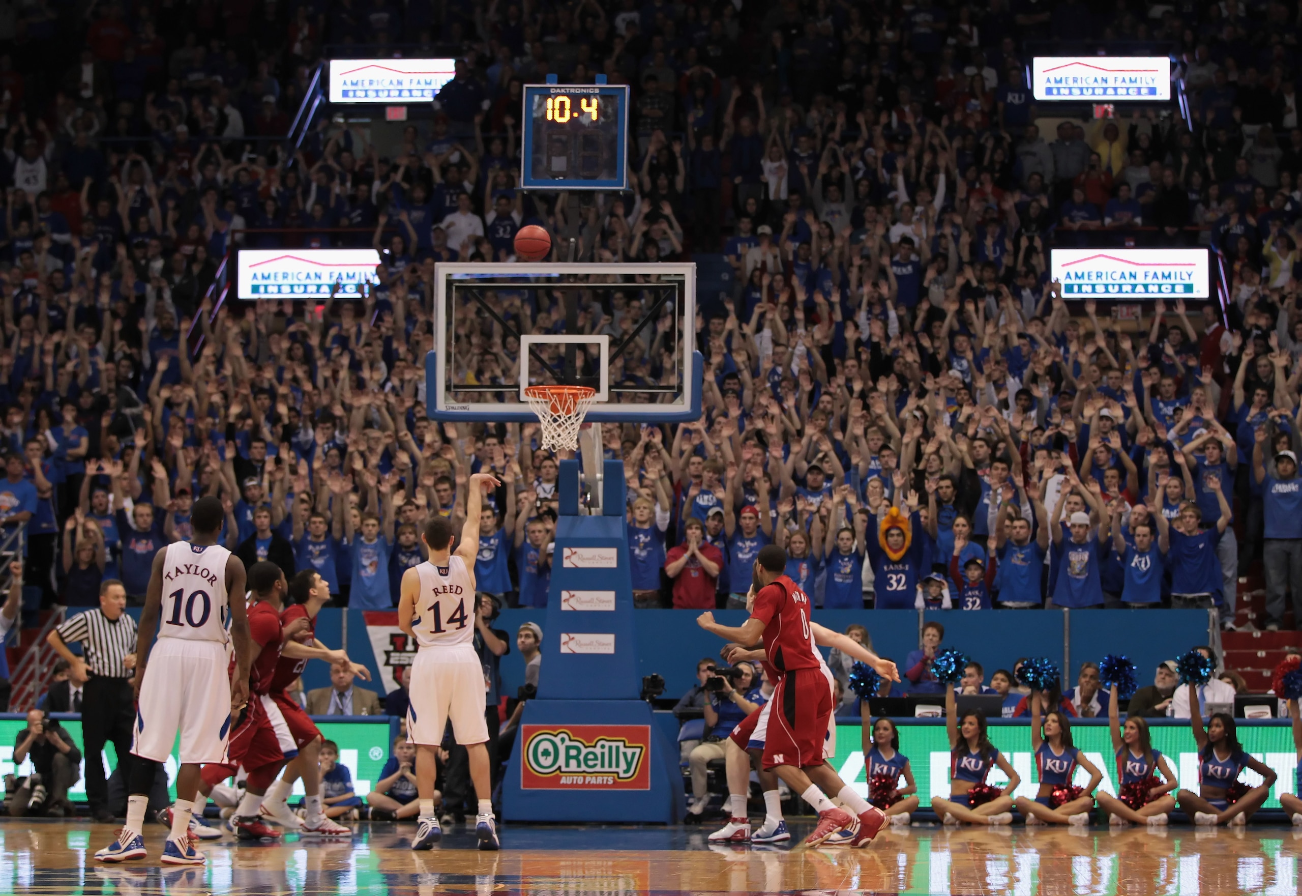 LAWRENCE, KS - JANUARY 15:  Tyrel Reed #14 of the Kansas Jayhawks shoots a final free throw to put Kansas on top for good during the game against the Nebraska Cornhuskers on January 15, 2011 at Allen Fieldhouse in Lawrence, Kansas.  (Photo by Jamie Squire