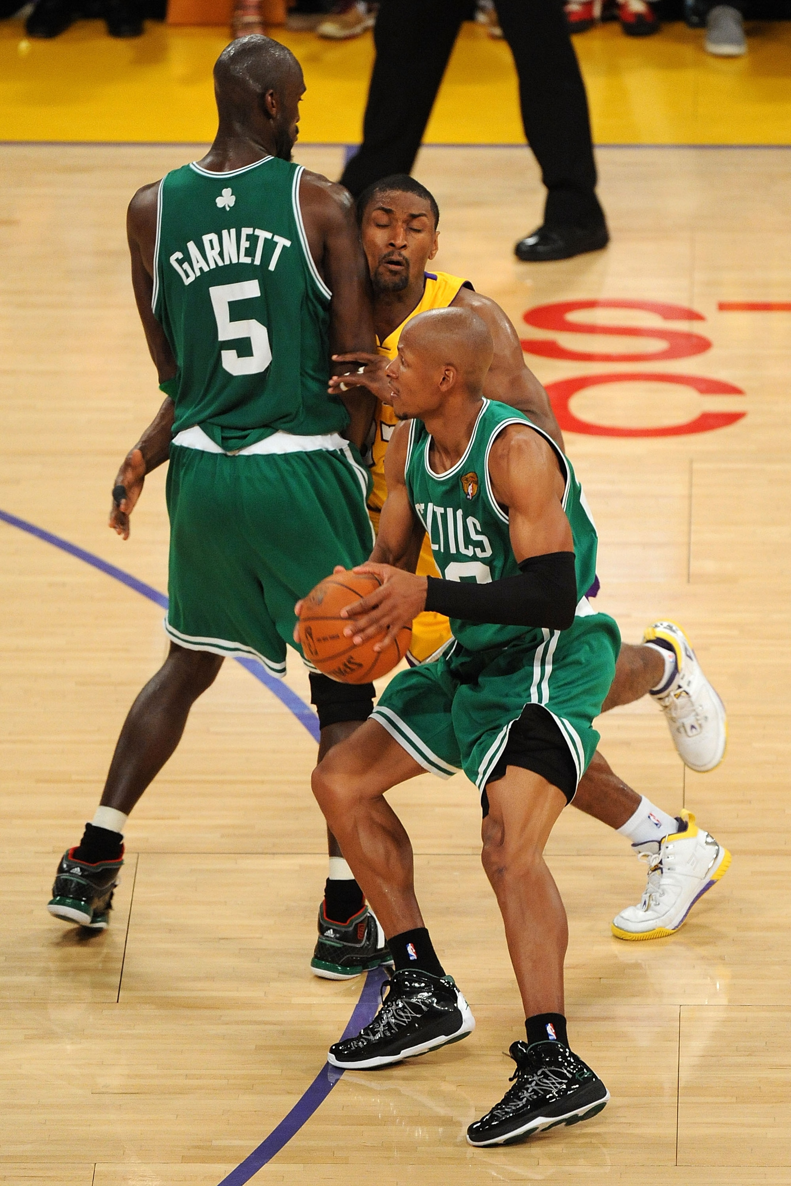 LOS ANGELES, CA - JUNE 17:  Ray Allen #20 of the Boston Celtics moves the ball as Ron Artest #37 of the Los Angeles Lakers is screened by Kevin Garnett #5 of the Celtics in the third quarter of Game Seven of the 2010 NBA Finals at Staples Center on June 1