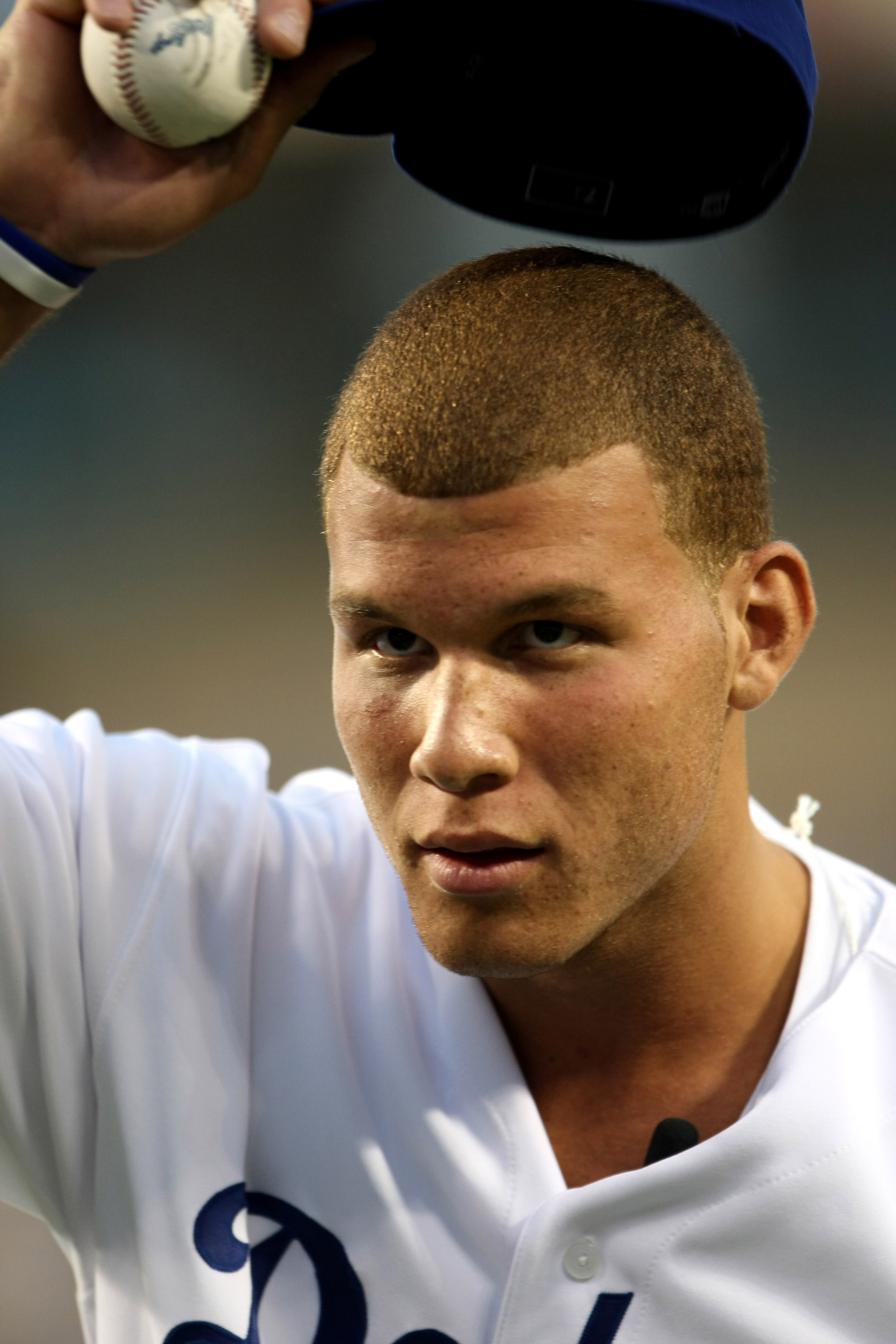 LOS ANGELES, CA - SEPTEMBER 02:  First overall pick in the NBA draft Blake Griffin of the Los Angeles Clippers tips his cap before throwing out a ceremonial first pitch before the game between the Los Angeles Dodgers the Arizona Diamondbacks on September