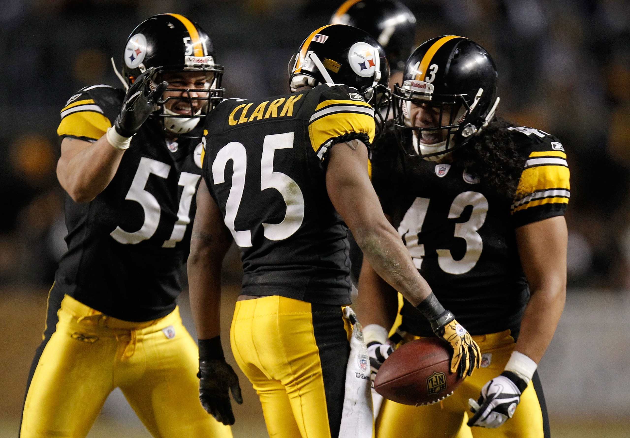 PITTSBURGH, PA - JANUARY 15:  Safety Ryan Clark #25 of the Pittsburgh Steelers celebrates with teammates James Farrior #51 and Troy Polamalu #43 after an interception of quarterback Joe Flacco #5 of the Baltimore Ravens in the third quarter of the AFC Div