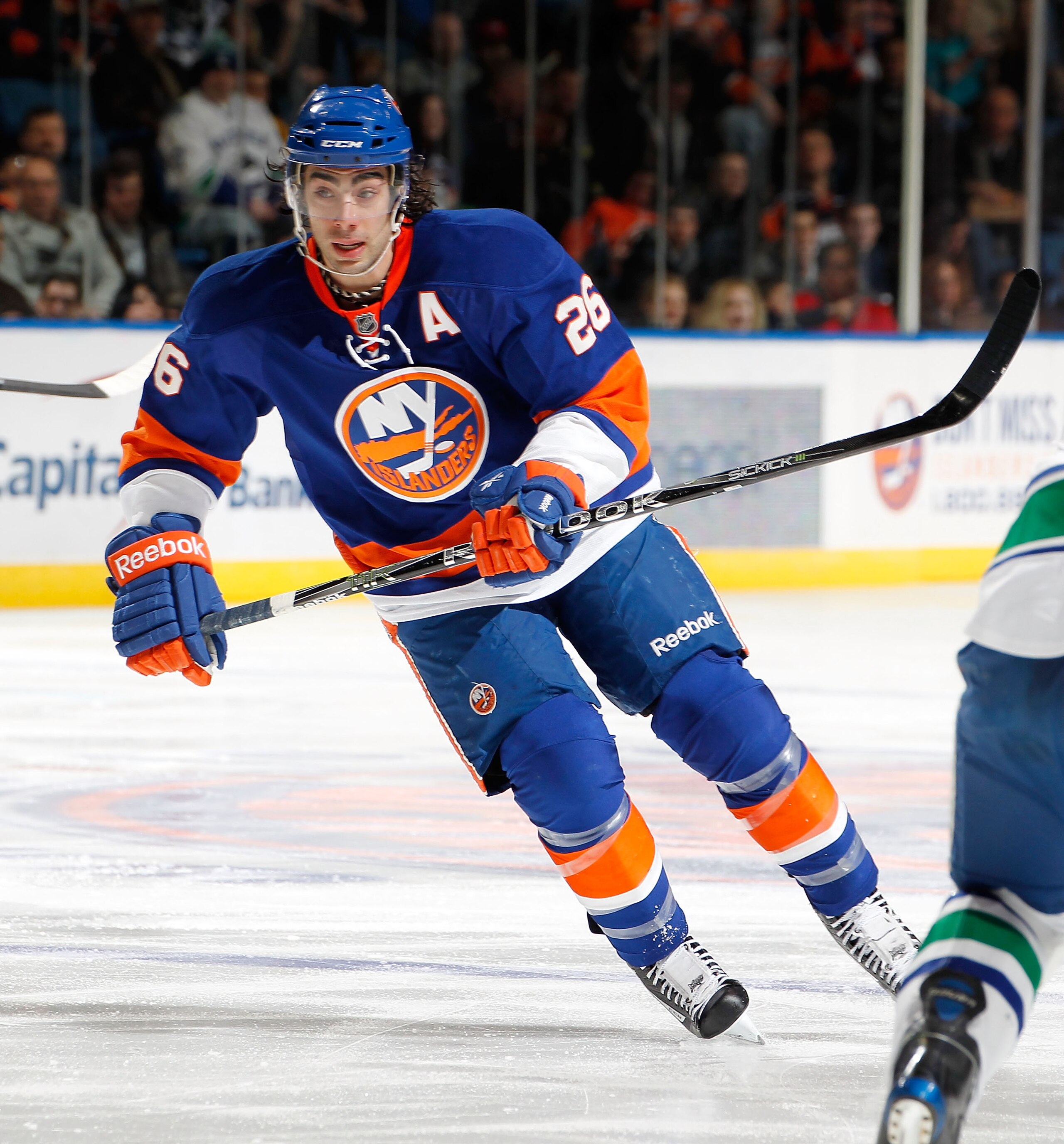 UNIONDALE, NY - JANUARY 11:  Matt Moulson #26 of the New York Islanders skates during an NHL game against the Vancouver Canucks at the Nassau Coliseum on January 11, 2011 in Uniondale, New York.  (Photo by Paul Bereswill/Getty Images)