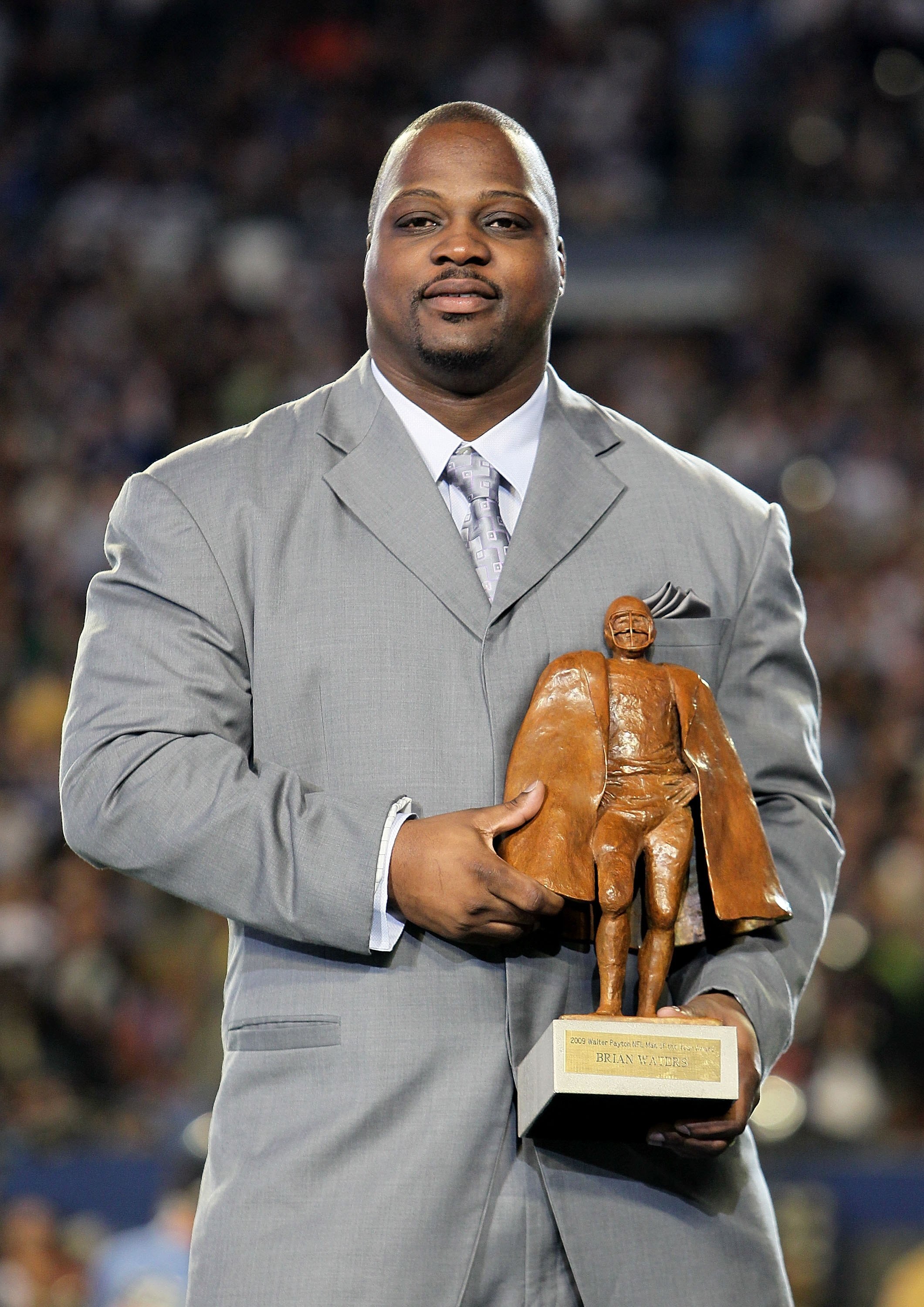 MIAMI GARDENS, FL - FEBRUARY 07:  Kansas City Chiefs guard Brian Waters accepts his 2009 Walter Payton NFL Man of the Year before Super Bowl XLIV on February 7, 2010 at Sun Life Stadium in Miami Gardens, Florida.  (Photo by Andy Lyons/Getty Images)