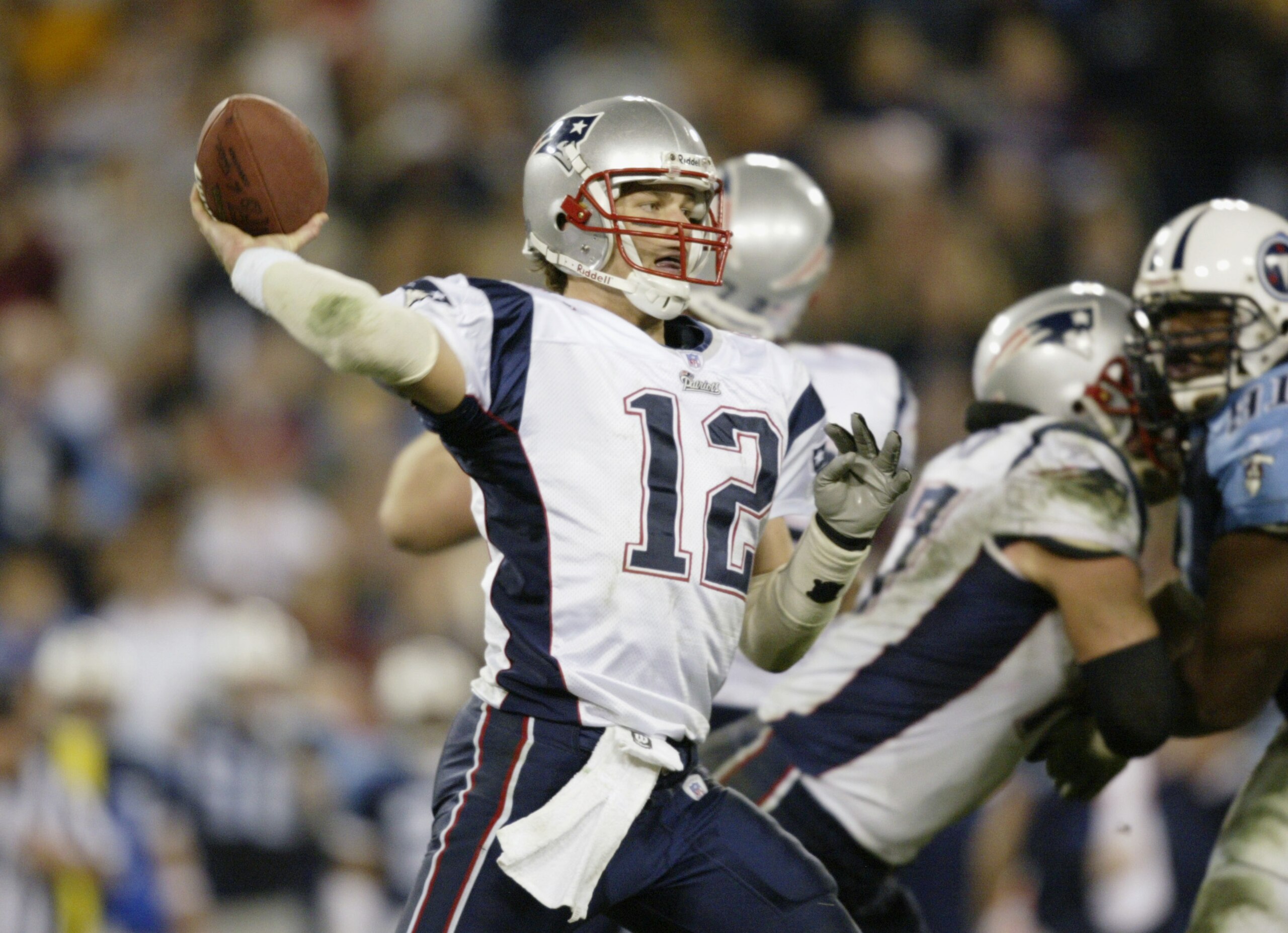 NASHVILLE, TN - DECEMBER 16:  Quarterback Tom Brady #12 of the New England Patriots passes against the Tennessee Titans at the Coliseum on December 16, 2002 in Nashville, Tennessee. The Titans won 37-24. (Photo by Elsa/Getty Images)