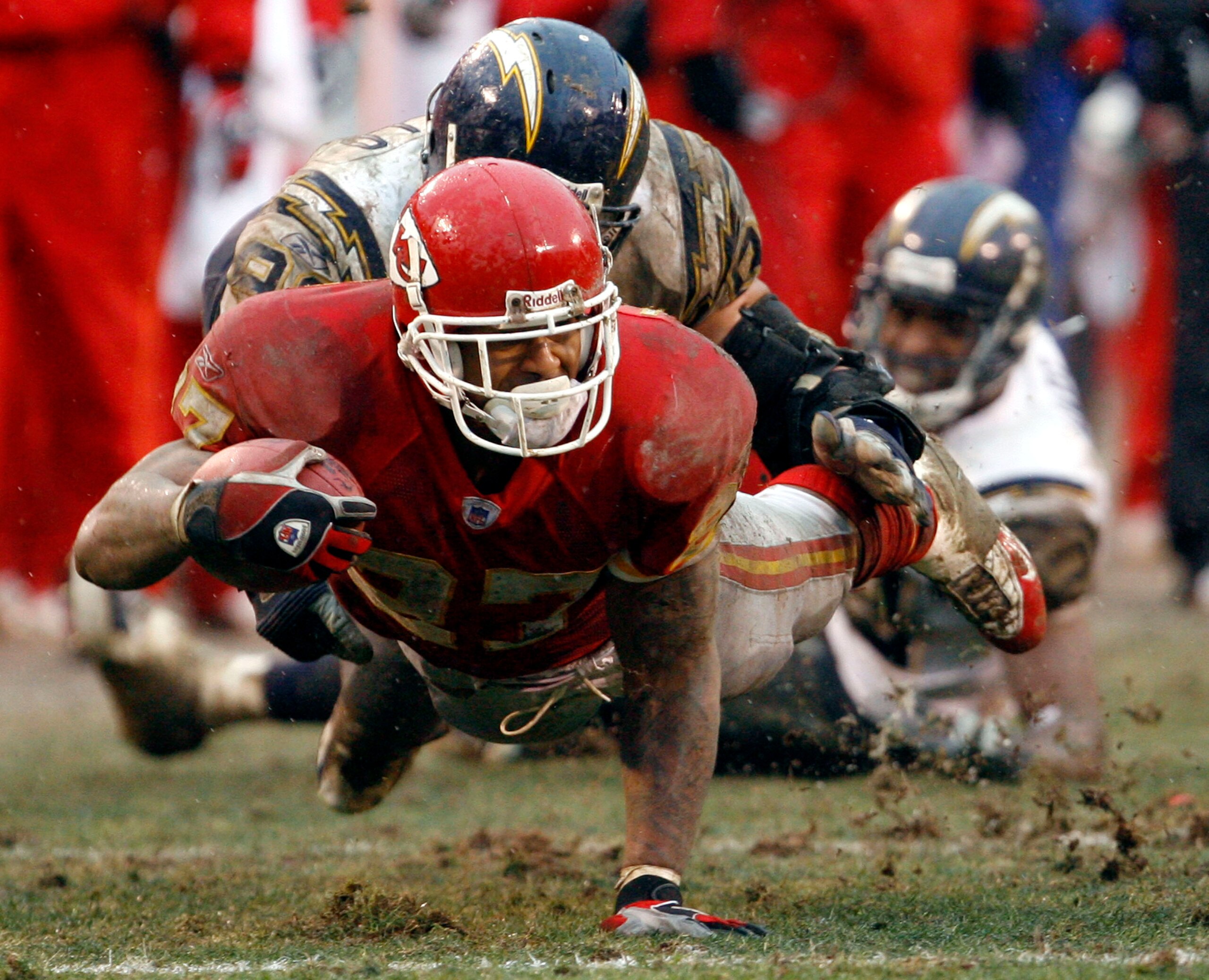KANSAS CITY, MO - DECEMBER 24:  Larry Johnson #27 of the Kansas City Chiefs is tackled by Luis Castillo #93 of the San Diego Chargers in the fourth quarter on December 24, 2005 at Arrowhead Stadium in Kansas City, Missouri. Kansas City Chiefs won 20-7 ove