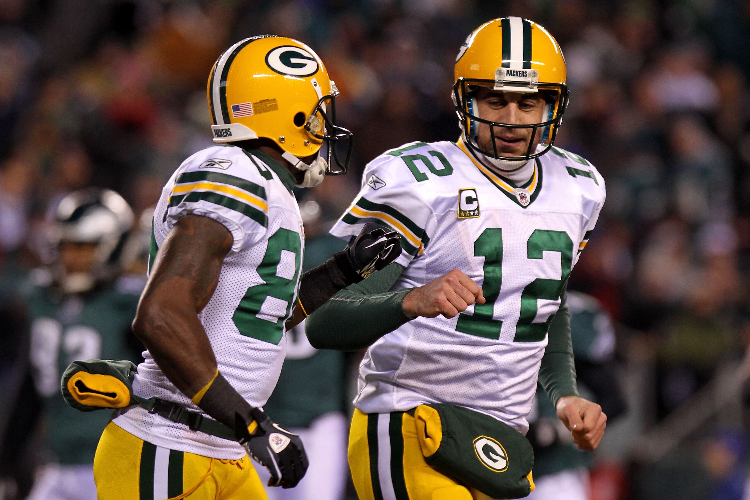 PHILADELPHIA, PA - JANUARY 09:  Aaron Rodgers #12 of the Green Bay Packers and Donald Driver #80 celebrate after a touchdown in the first quarter against the Philadelphia Eagles during the 2011 NFC wild card playoff game at Lincoln Financial Field on Janu