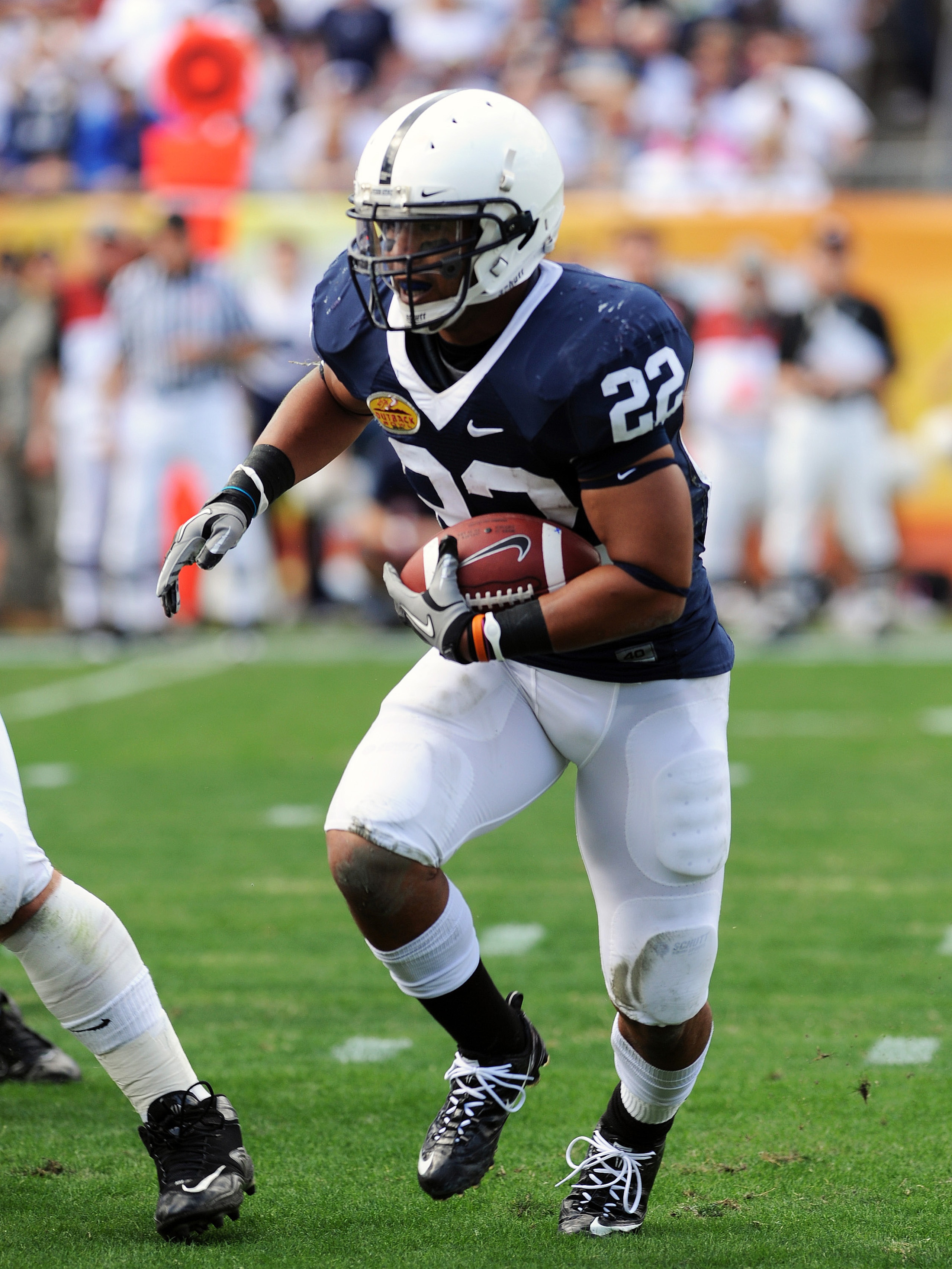 TAMPA, FL - JANUARY 1:  Running back Evan Royster #22 of the Penn State Nittany Lions rushes upfield against the Florida Gators January 1, 2010 in the 25th Outback Bowl at Raymond James Stadium in Tampa, Florida.  (Photo by Al Messerschmidt/Getty Images)