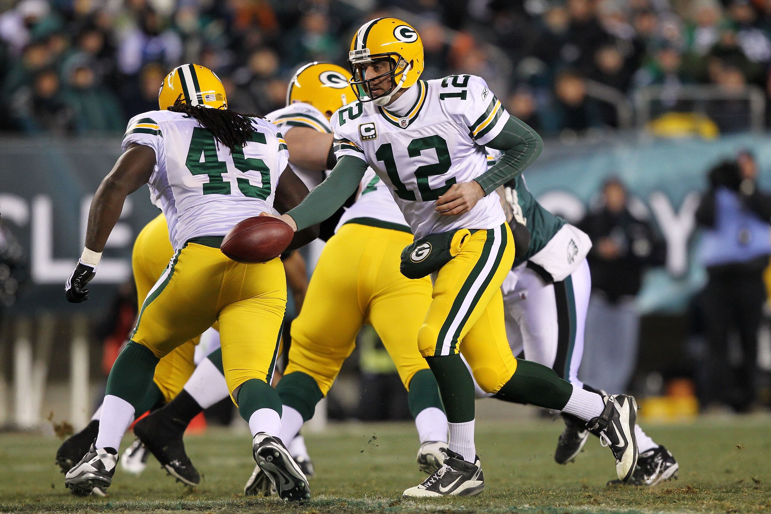 PHILADELPHIA, PA - JANUARY 09:  Aaron Rodgers #12 of the Green Bay Packers runs a play against the Philadelphia Eagles during the 2011 NFC wild card playoff game at Lincoln Financial Field on January 9, 2011 in Philadelphia, Pennsylvania.  (Photo by Al Be