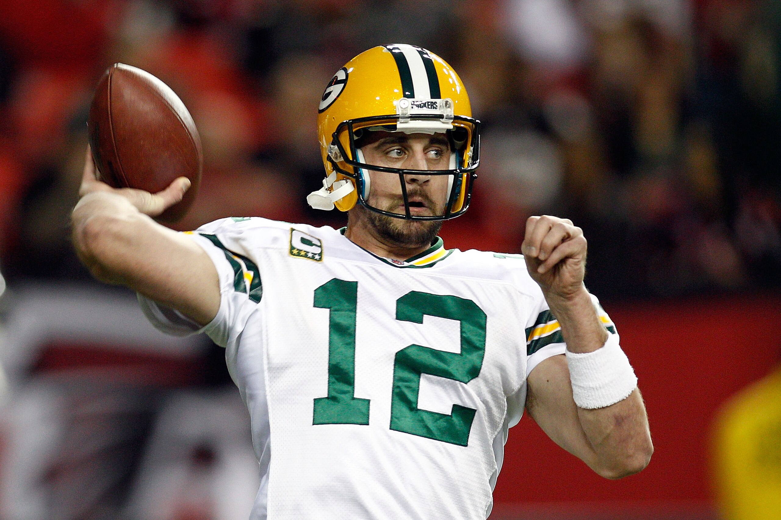 ATLANTA, GA - JANUARY 15:  Aaron Rodgers #12 of the Green Bay Packers warms up against the Atlanta Falcons during their 2011 NFC divisional playoff game at Georgia Dome on January 15, 2011 in Atlanta, Georgia.  (Photo by Chris Graythen/Getty Images)