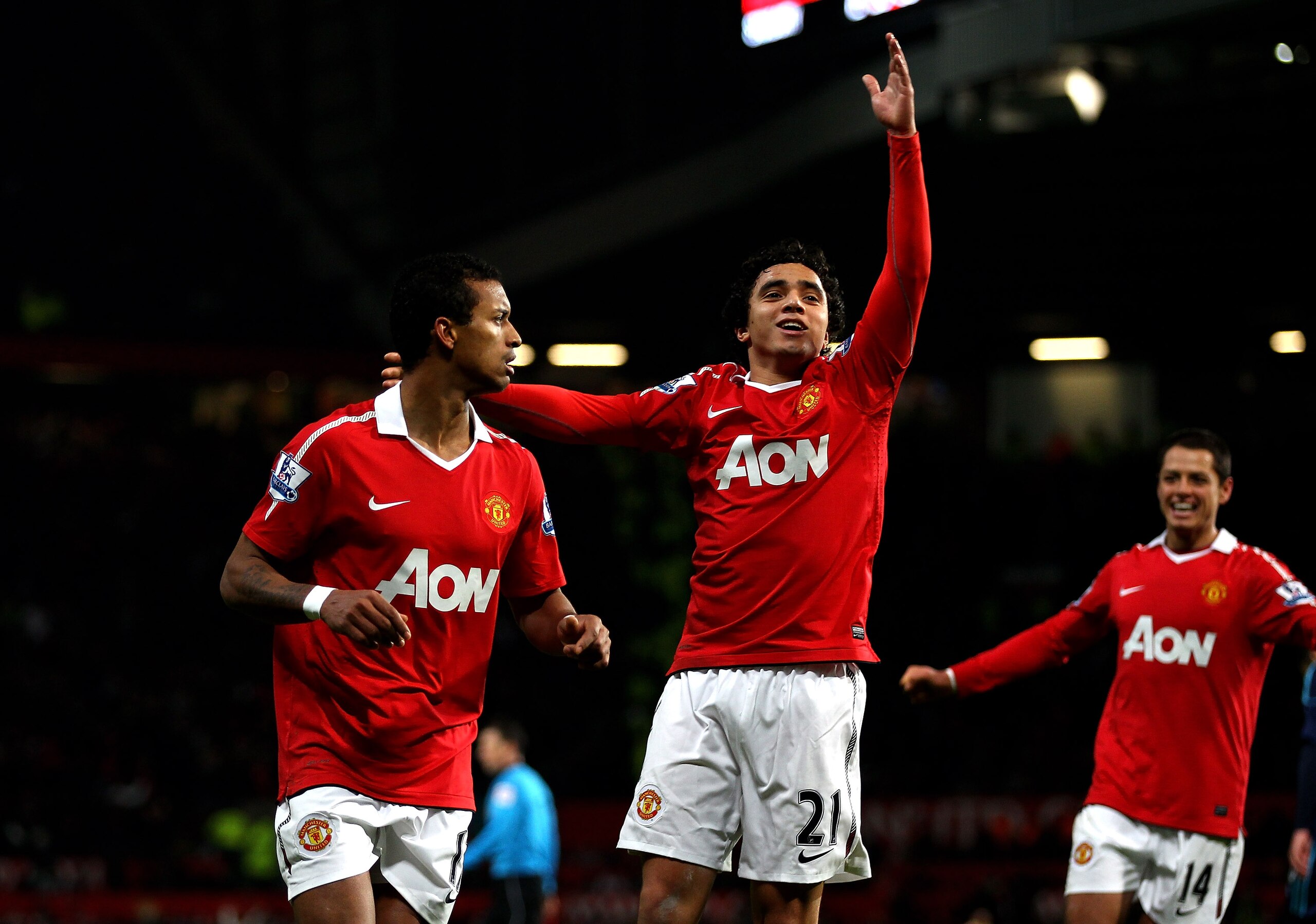 MANCHESTER, ENGLAND - JANUARY 04:  Nani (L) of Manchester United celebrates scoring his team's second goal with team mate Rafael during the Barclays Premier League match between Manchester United and Stoke City at Old Trafford on January 4, 2011 in Manche