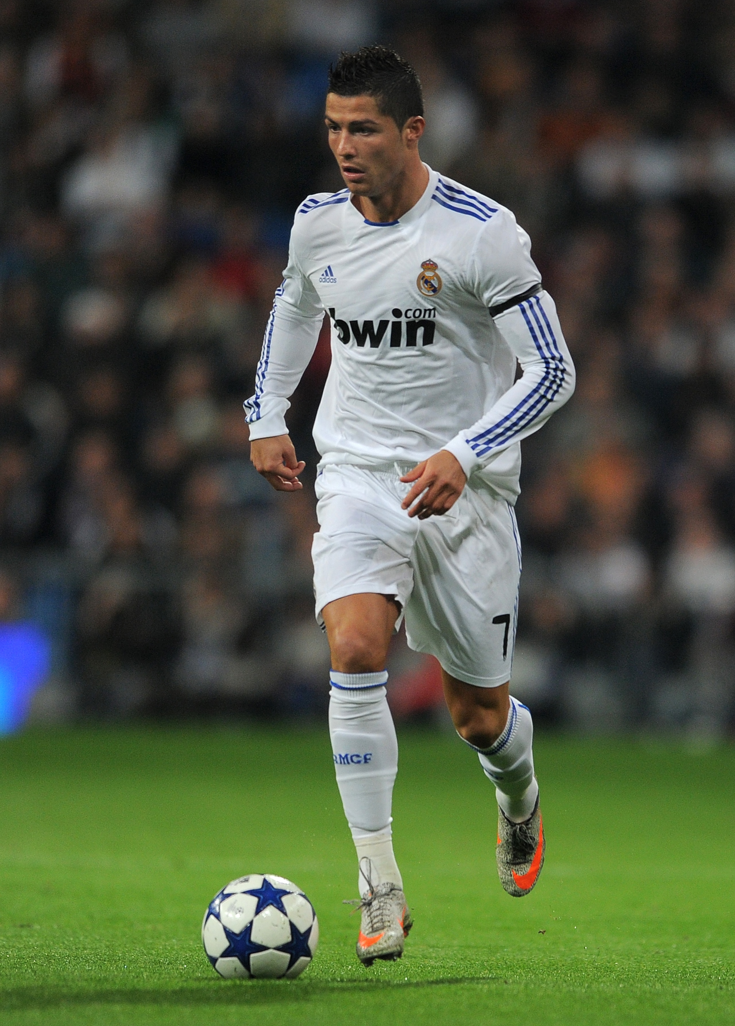 MADRID, SPAIN - JANUARY 13:  Cristiano Ronaldo of Real Madrid controls the ball during the quarter-final Copa del Rey first leg match between Real Madrid and Atletico Madrid at Estadio Santiago Bernabeu on January 13, 2011 in Madrid, Spain.  (Photo by Jas