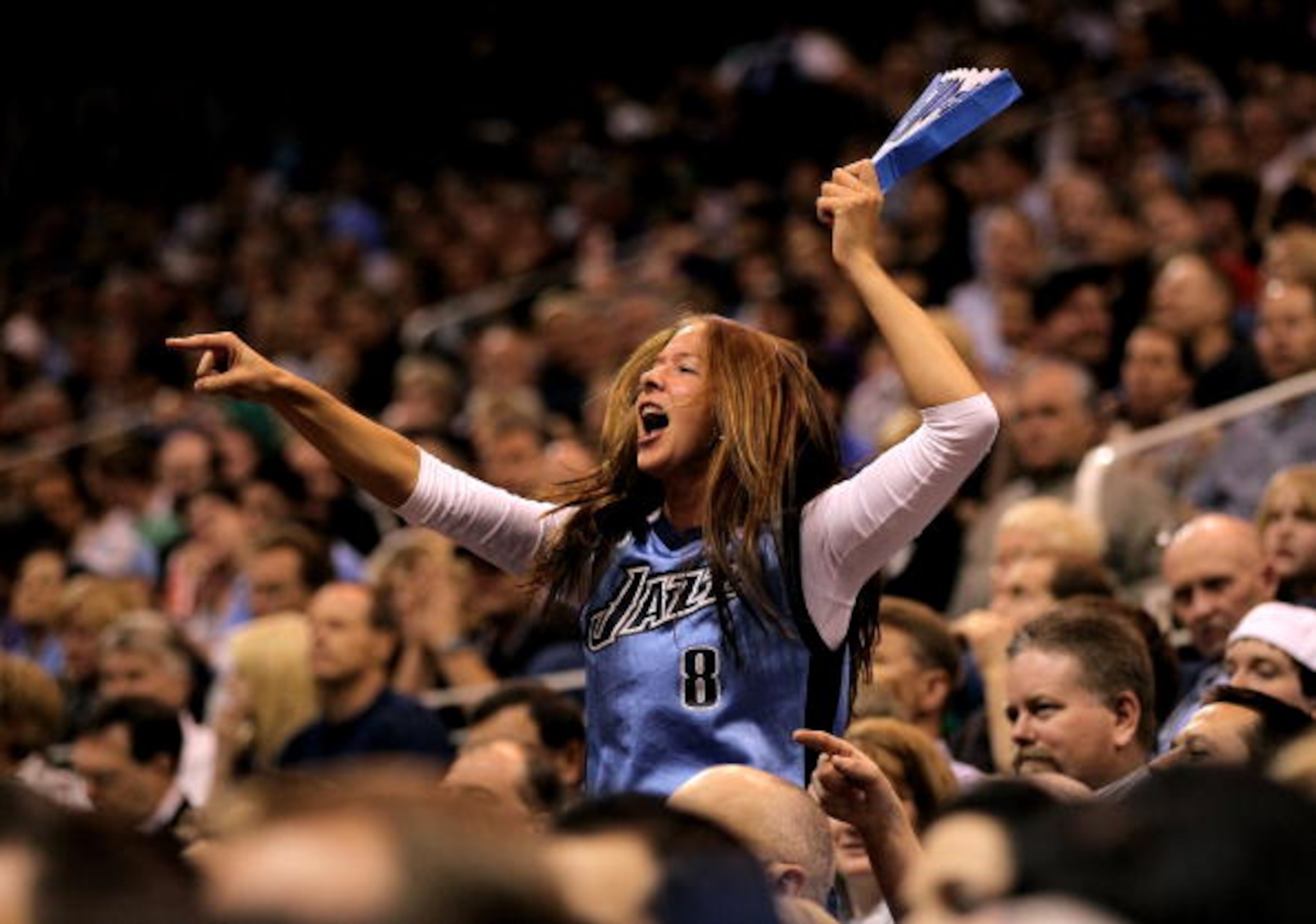 SALT LAKE CITY - APRIL 30: A Utah Jazz fan cheers for her team during their game against the Denver Nuggets in Game Six of the Western Conference Quarterfinals of the 2010 NBA Playoffs at EnergySolutions Arena on April 30, 2010 in Salt Lake City, Utah. N SALT LAKE CITY - APRIL 30: A Utah Jazz fan cheers for her team during their game against the Denver Nuggets in Game Six of the Western Conference Quarterfinals of the 2010 NBA Playoffs at EnergySolutions Arena on April 30, 2010 in Salt Lake City, Utah. N