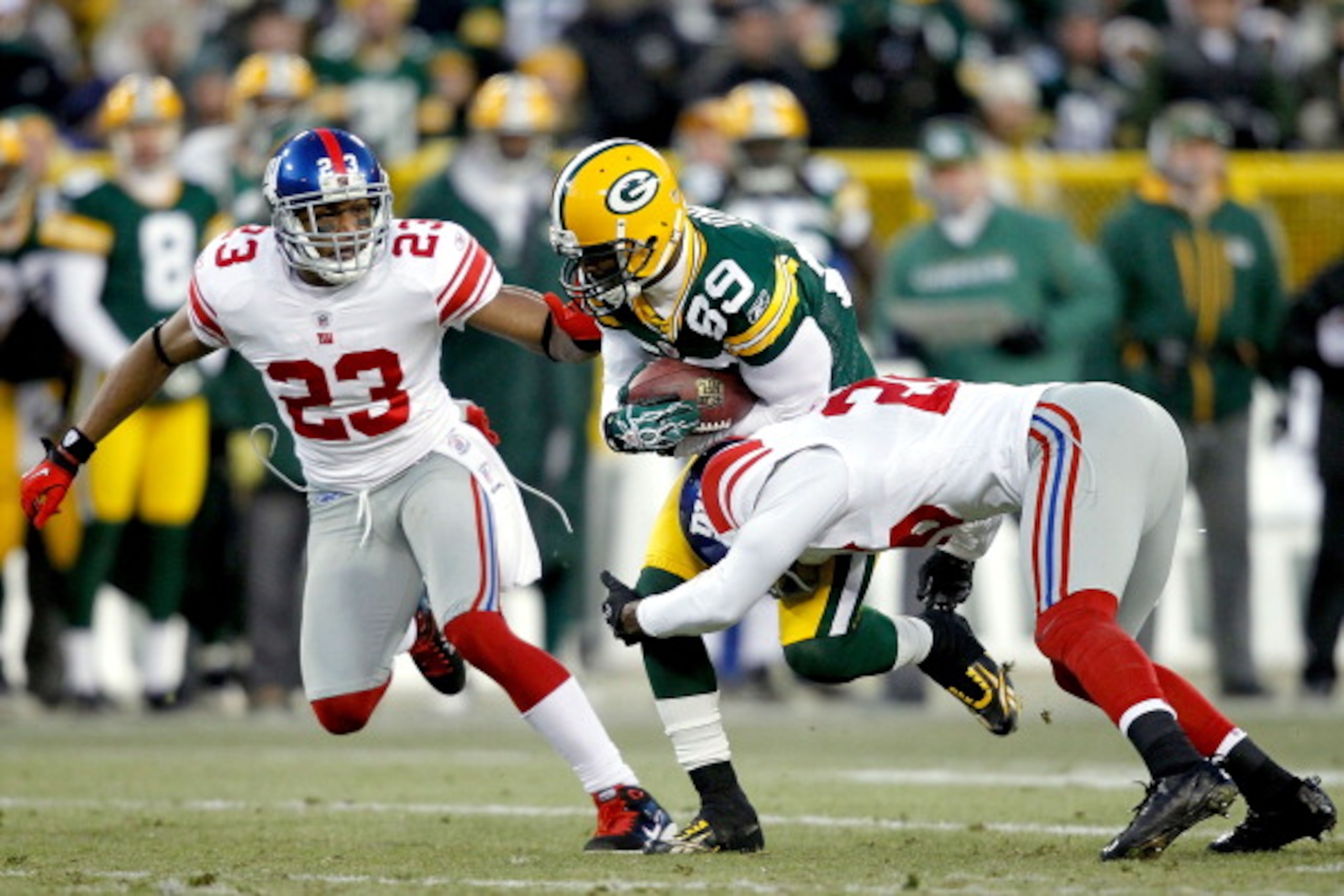 GREEN BAY, WI - DECEMBER 26:  James Jones #89 of the Green Bay Packers is tackled by Antrel Rolle #26 of the New York Giants at Lambeau Field on December 26, 2010 in Green Bay, Wisconsin.  (Photo by Matthew Stockman/Getty Images)