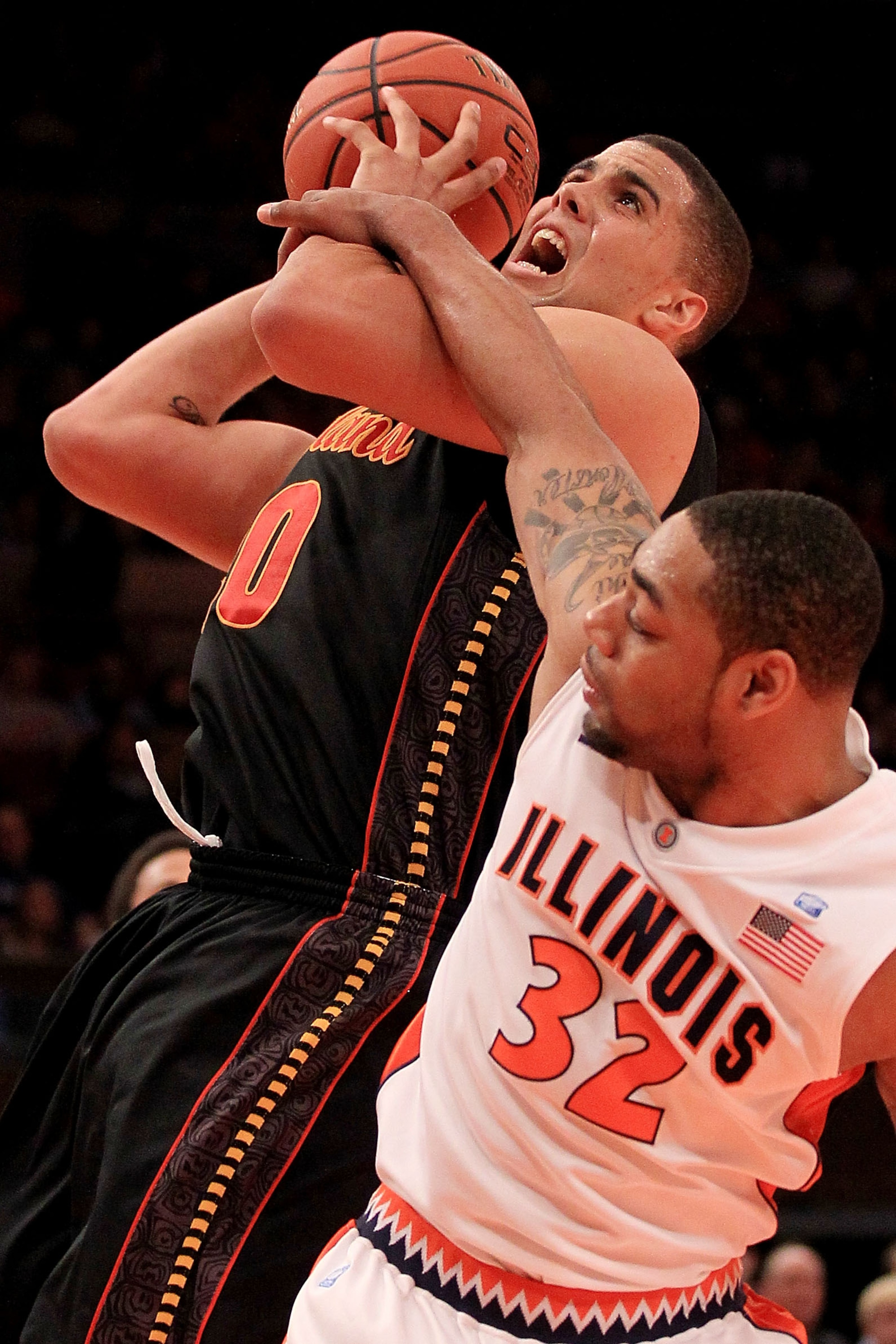 NEW YORK - NOVEMBER 19: Jordan Williams #20 of the Maryland Terrapins is fouled by Demetri McCamey #32 of the Illinois Fighting Illini during the 2k Sports Classic at Madison Square Garden on November 19, 2010 in New York, New York. (Photo by Chris McGra NEW YORK - NOVEMBER 19: Jordan Williams #20 of the Maryland Terrapins is fouled by Demetri McCamey #32 of the Illinois Fighting Illini during the 2k Sports Classic at Madison Square Garden on November 19, 2010 in New York, New York. (Photo by Chris McGra