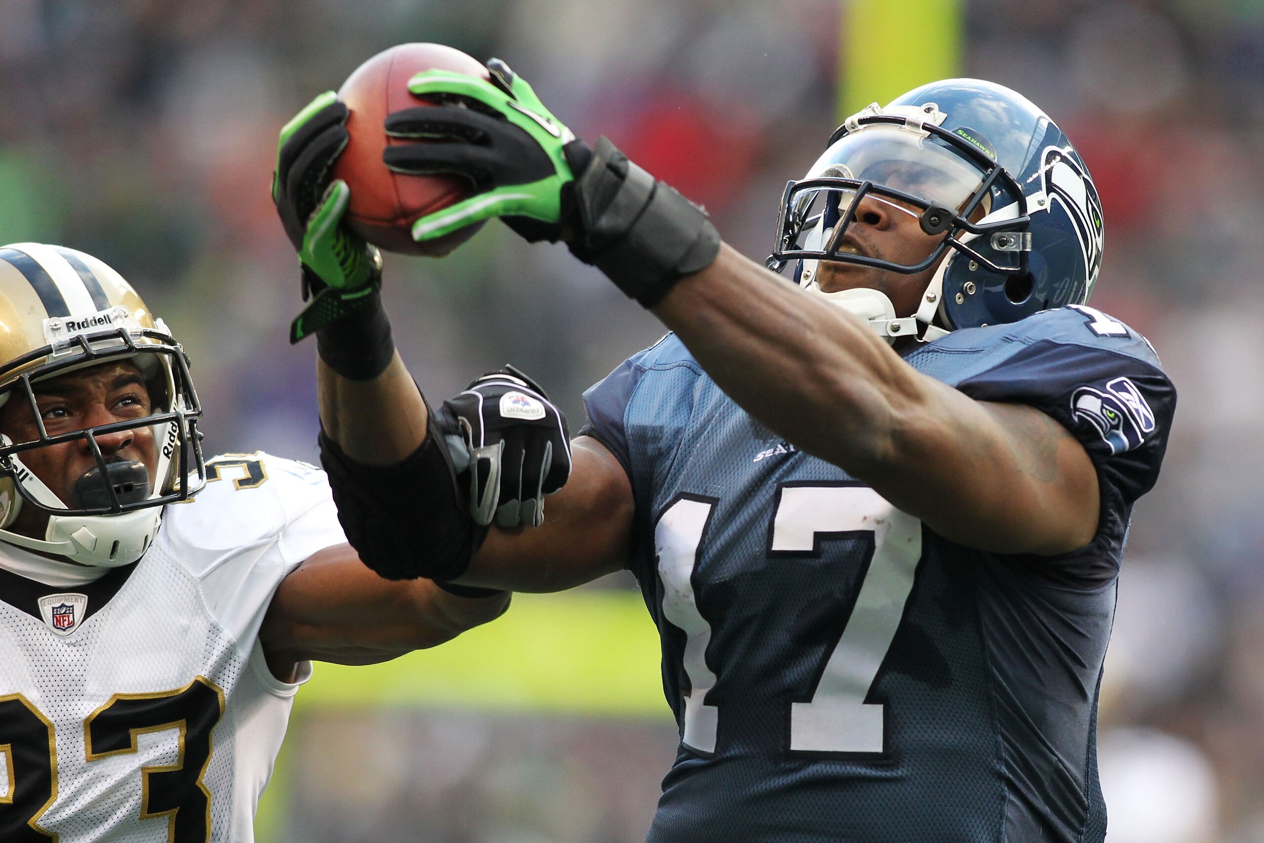 SEATTLE, WA - JANUARY 08:  Mike Williams #17 of the Seattle Seahawks completes a reception over Jabari Greer #33 of the New Orleans Saints during the 2011 NFC wild-card playoff game at Qwest Field on January 8, 2011 in Seattle, Washington.  (Photo by Jona