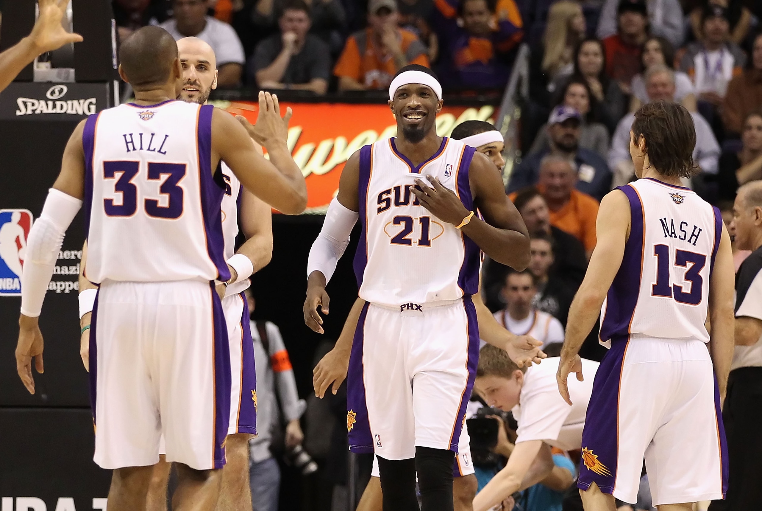 PHOENIX, AZ - JANUARY 14:  Hakim Warrick #21 of the Phoenix Suns celebrates with teammates Grant Hill #33 and Steve Nash #13 after scoring against the Portland Trail Blazers during the NBA game at US Airways Center on January 14, 2011 in Phoenix, Arizona.