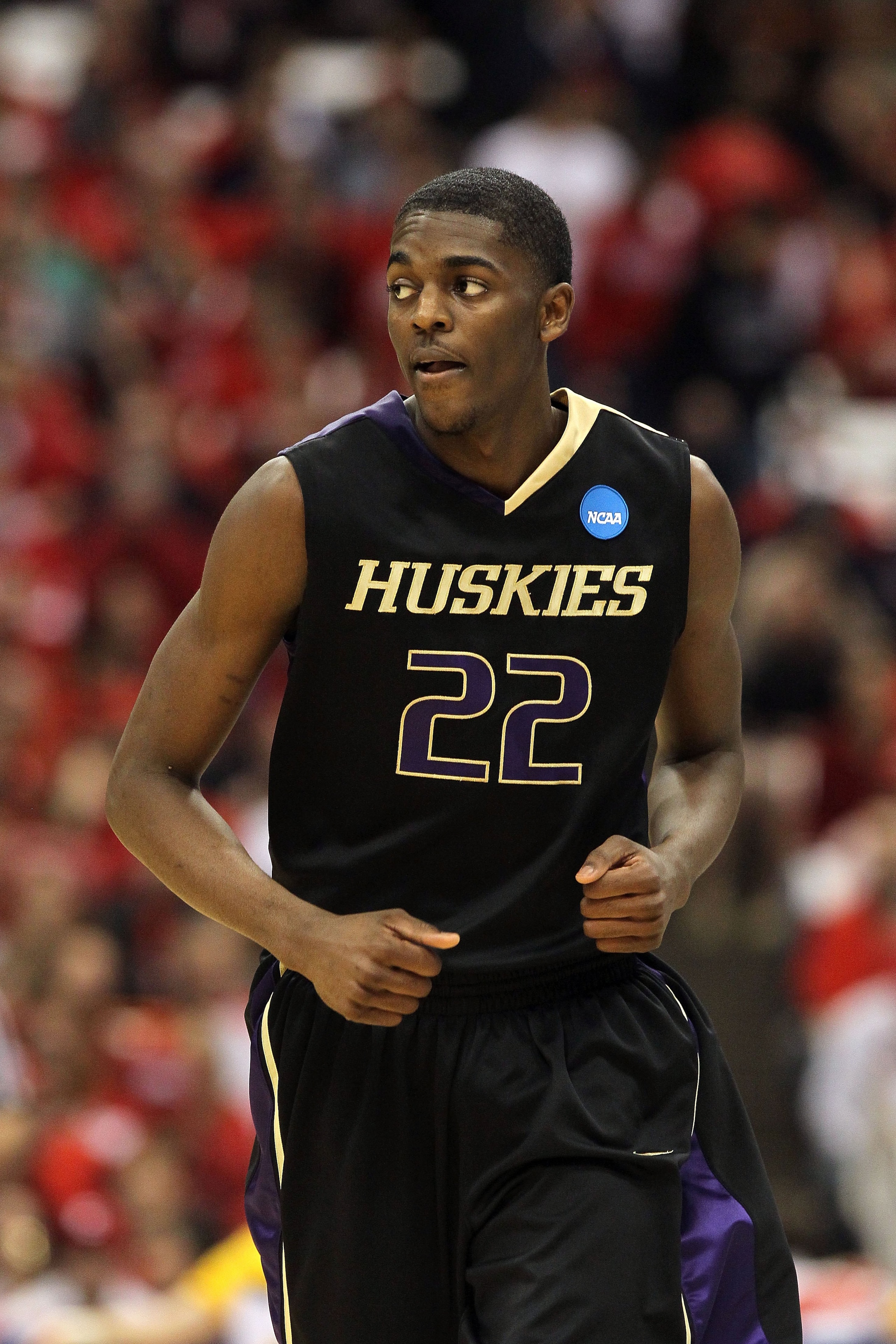 SYRACUSE, NY - MARCH 25:  Justin Holiday #22 of the Washington Huskies runs up court against the West Virginia Mountaineers during the east regional semifinal of the 2010 NCAA men's basketball tournament at the Carrier Dome on March 25, 2010 in Syracuse,