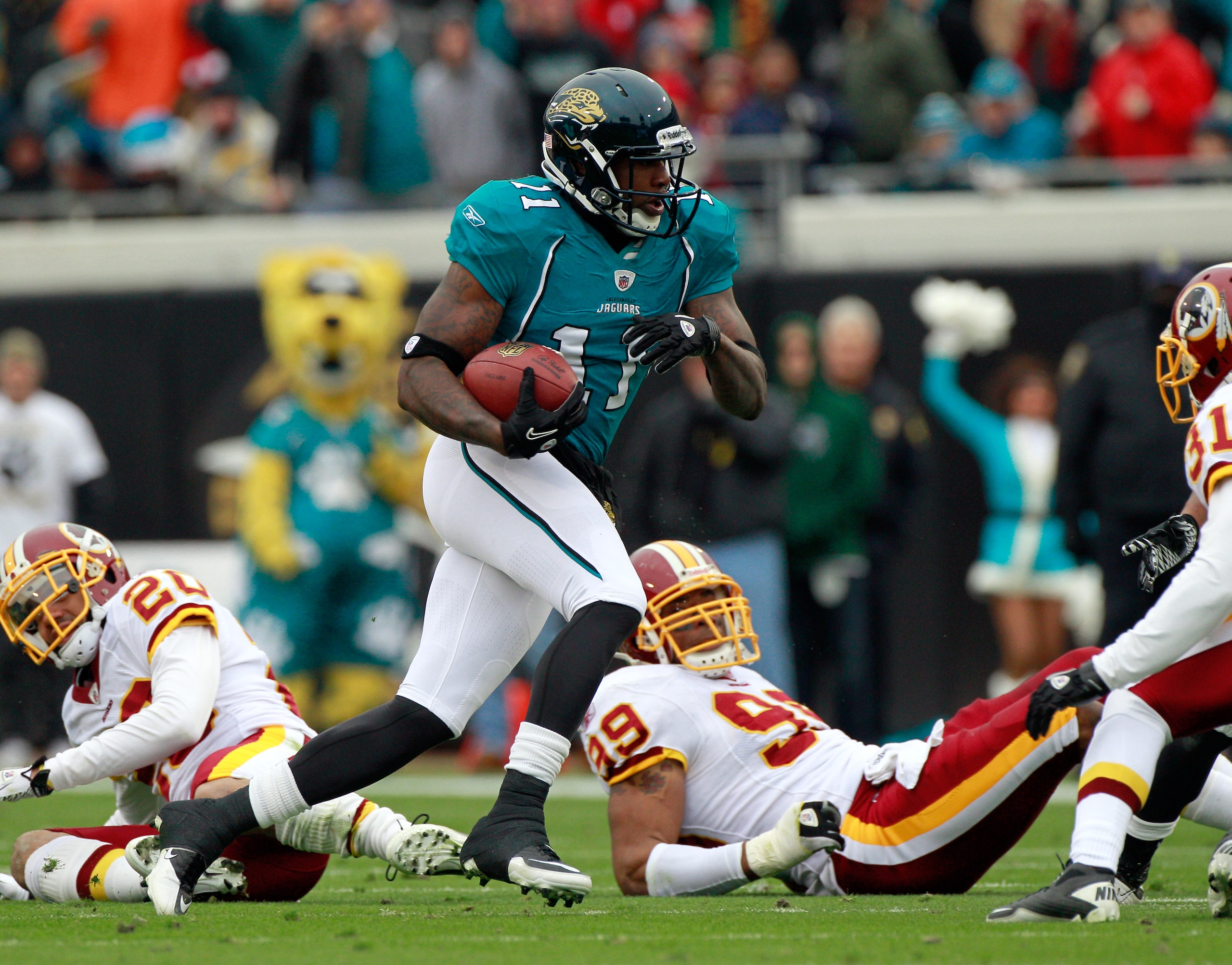 JACKSONVILLE, FL - DECEMBER 26:  Mike Sims-Walker #11 of the Jacksonville Jaguars runs after making a reception during the game against the Washington Redskins at EverBank Field on December 26, 2010 in Jacksonville, Florida.  (Photo by Sam Greenwood/Getty