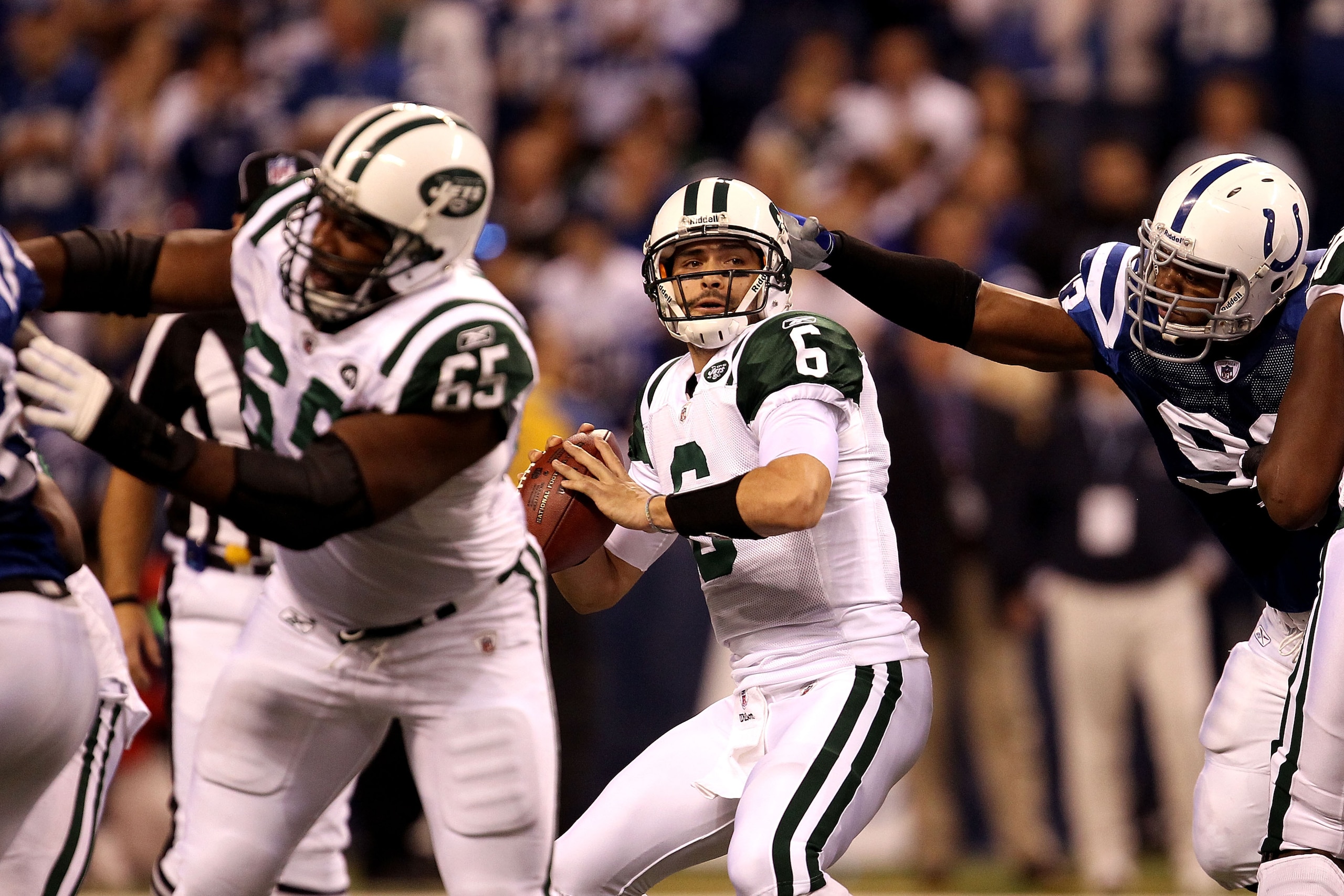 INDIANAPOLIS, IN - JANUARY 08:  Quarterback Mark Sanchez #6 of the New York Jets looks to pass the ball against the Indianapolis Colts during their 2011 AFC wild card playoff game at Lucas Oil Stadium on January 8, 2011 in Indianapolis, Indiana. The Jets