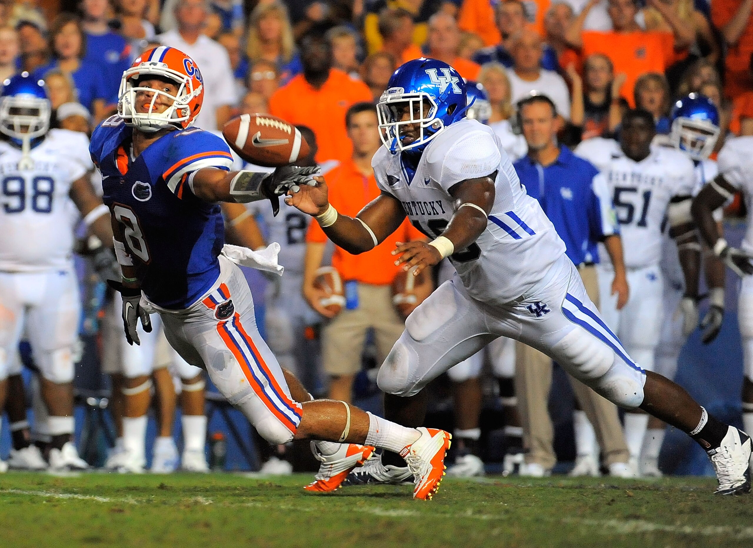 GAINESVILLE, FL - SEPTEMBER 25:  Half back Trey Burton #8 of the Florida Gators can't hang onto a pass in front of linebacker Ridge Wilson #48 of the Kentucky Wildcats at Ben Hill Griffin Stadium on September 25, 2010 in Gainesville, Florida.  (Photo by D