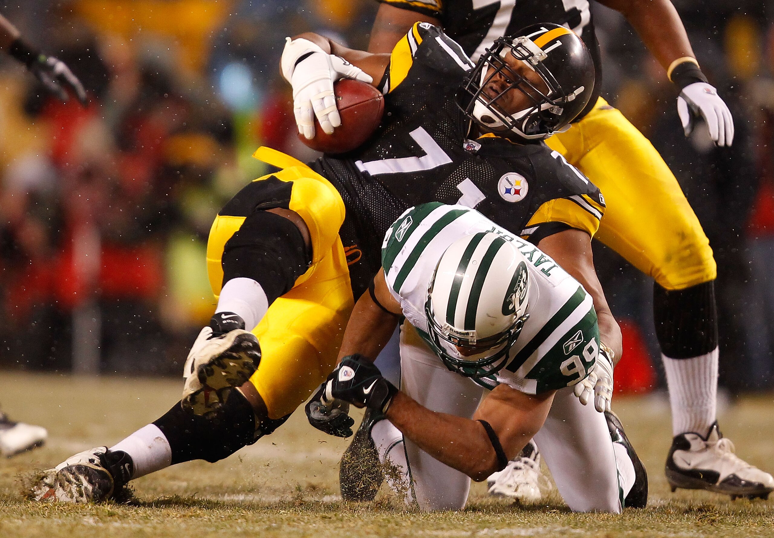 PITTSBURGH - DECEMBER 19:  Flozell Adams #71 of the Pittsburgh Steelers is tackled by Jason Taylor #99 of the New York Jets after recovering a fumble during the game on December 19, 2010 at Heinz Field in Pittsburgh, Pennsylvania.  (Photo by Jared Wickerh