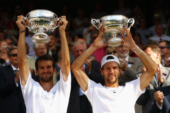 LONDON, ENGLAND - JULY 03:  Jurgen Melzer of Austria (R) and Philipp Petzschner of Germany celebrate after winning the Mens Doubles Final against Robert Lindstedt of Sweden and Horia Tecau of Romania on Day Twelve of the Wimbledon Lawn Tennis Championship